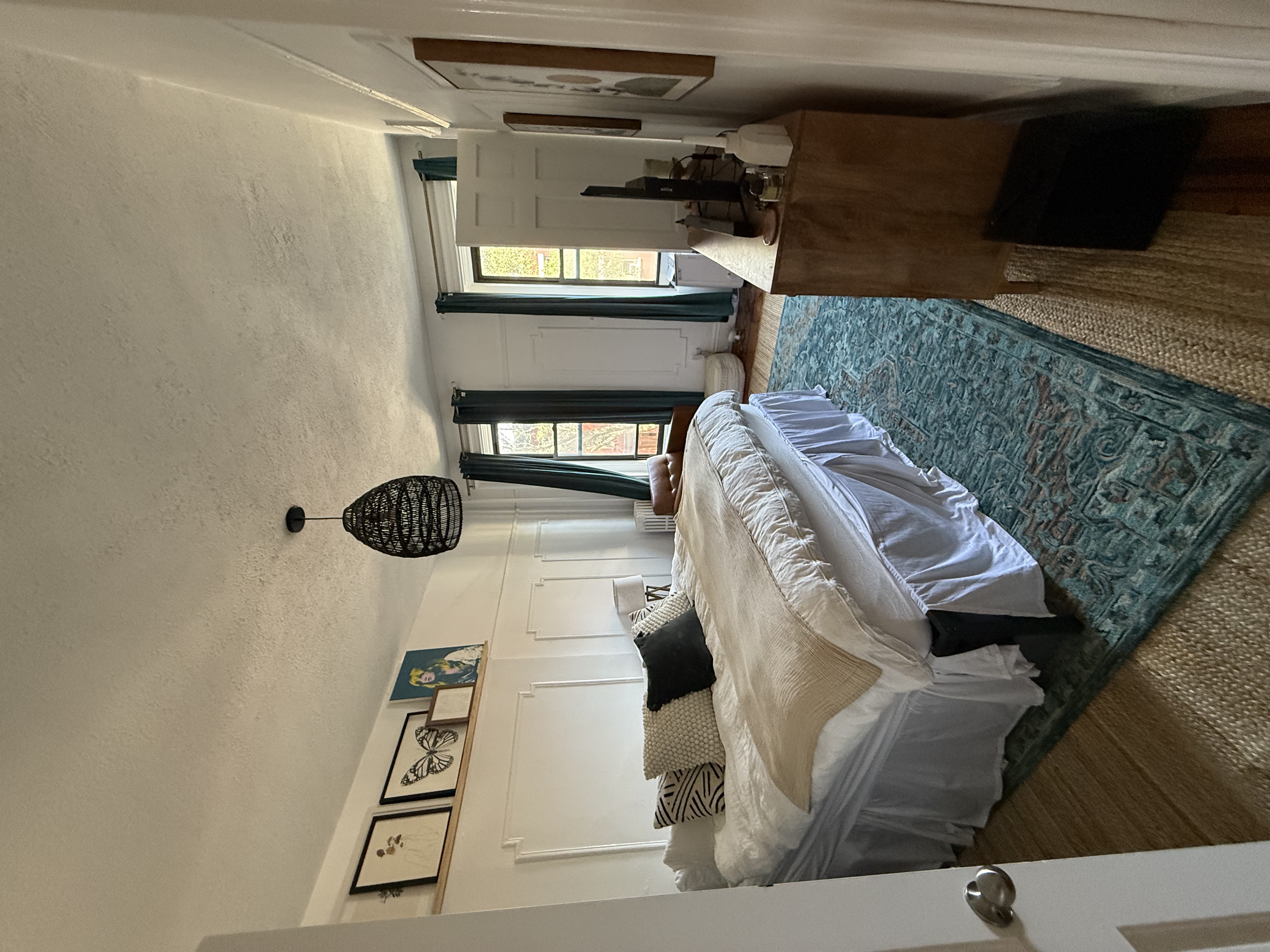 230 17th Street, Unit 2 Brooklyn, NY 11215 - Photo 10 of 16 a spacious bedroom with a bed a mirror and windows