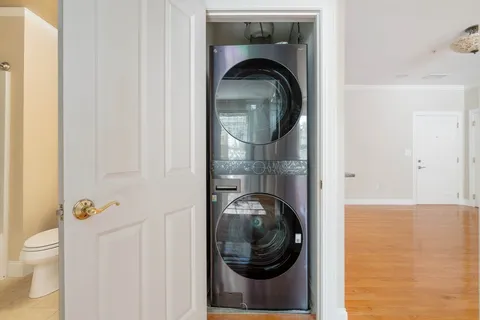 a close view of a utility room with dryer and washer