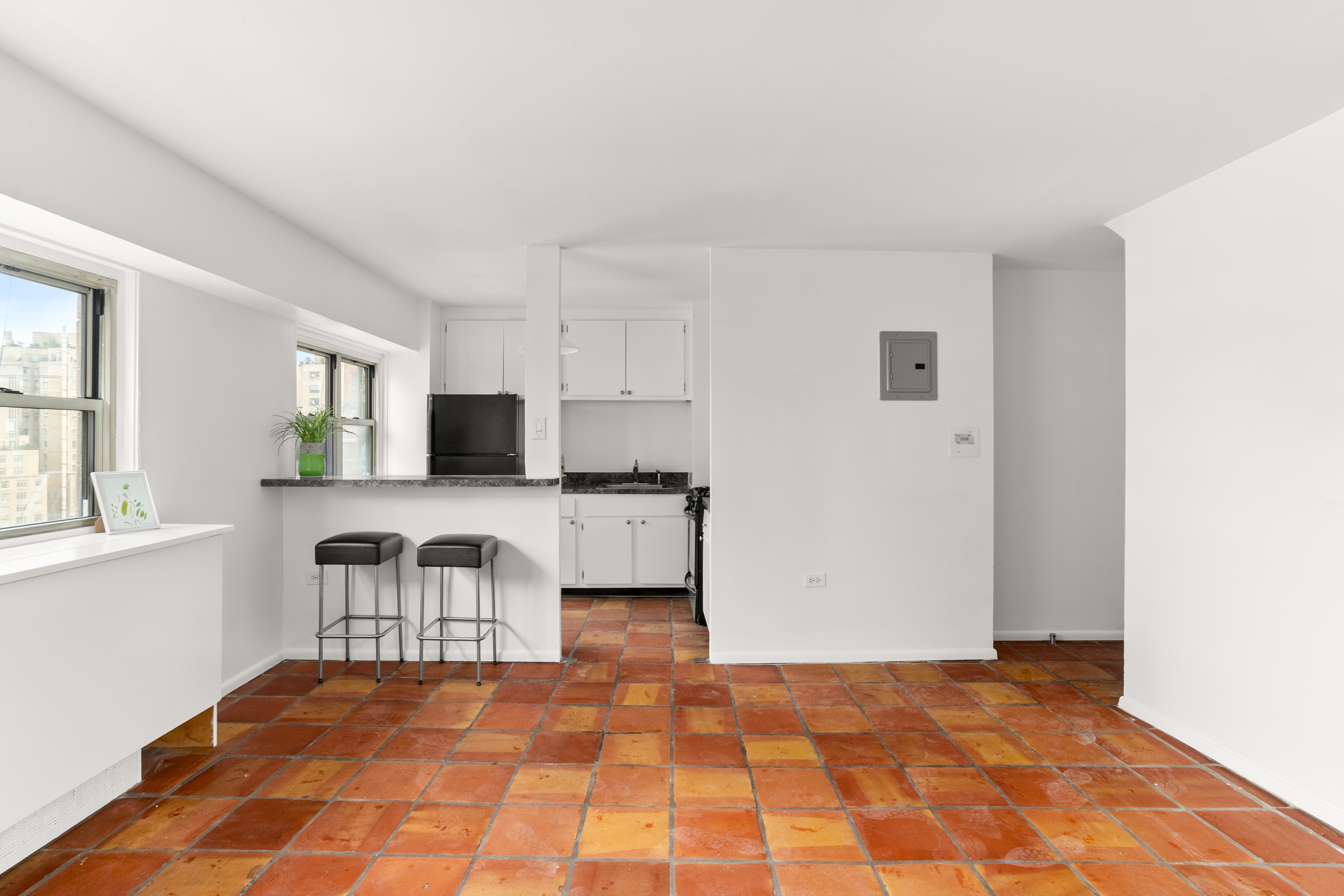 609 Columbus Avenue, Unit 14E Manhattan, NY 10024 - Photo 5 of 24 a view of a kitchen with microwave and cabinets
