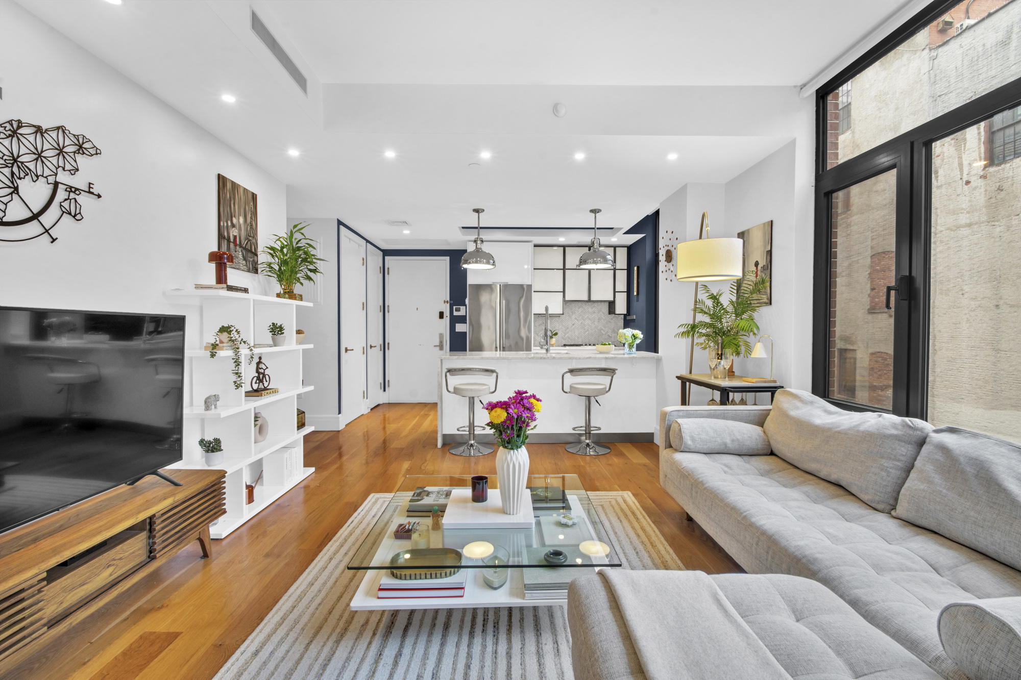 47 Bridge Street, Unit 3D Brooklyn, NY 11201 - Photo 7 of 27 a living room with furniture and a fireplace