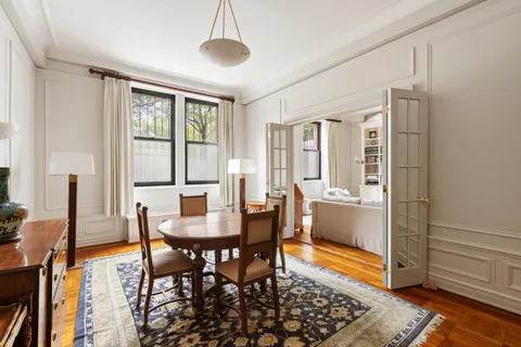a dining room with furniture and window