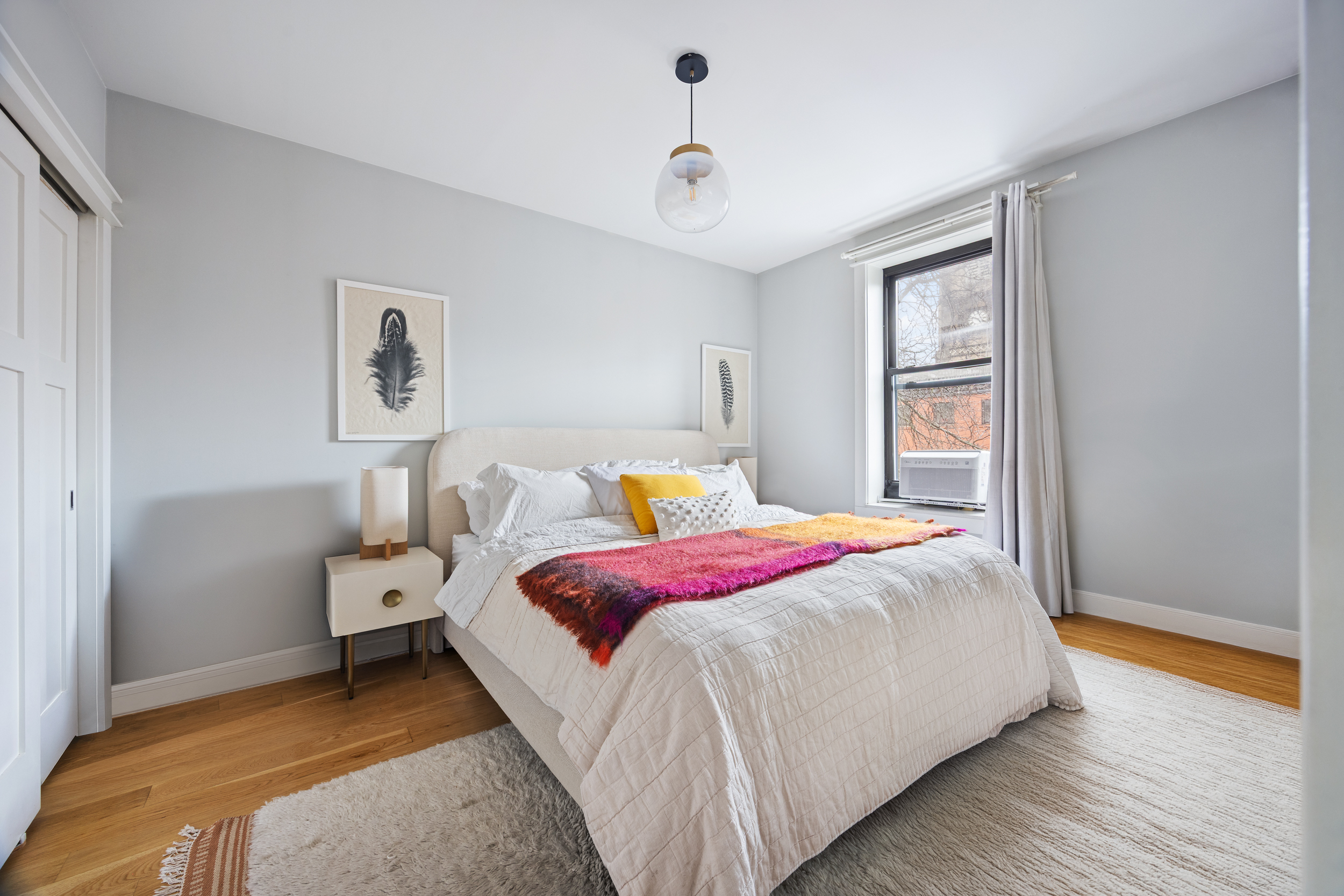 342 West 21st Street, Unit 4B Manhattan, NY 10011 - Photo 7 of 9 a bedroom with bed and window
