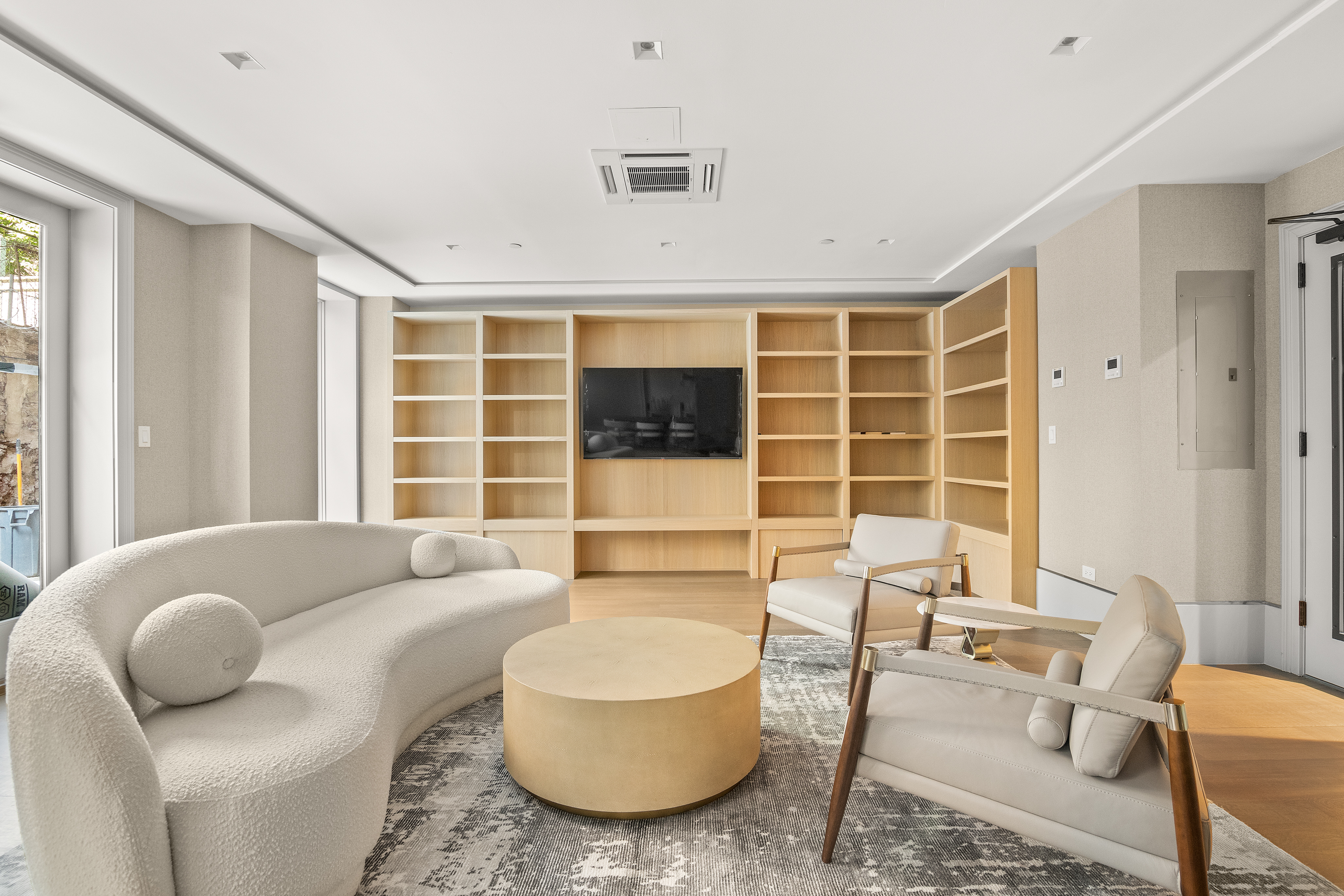 150 West 82nd Street, Unit 7A Manhattan, NY 10024 - Photo 14 of 15 a living room with furniture windows and a flat screen tv