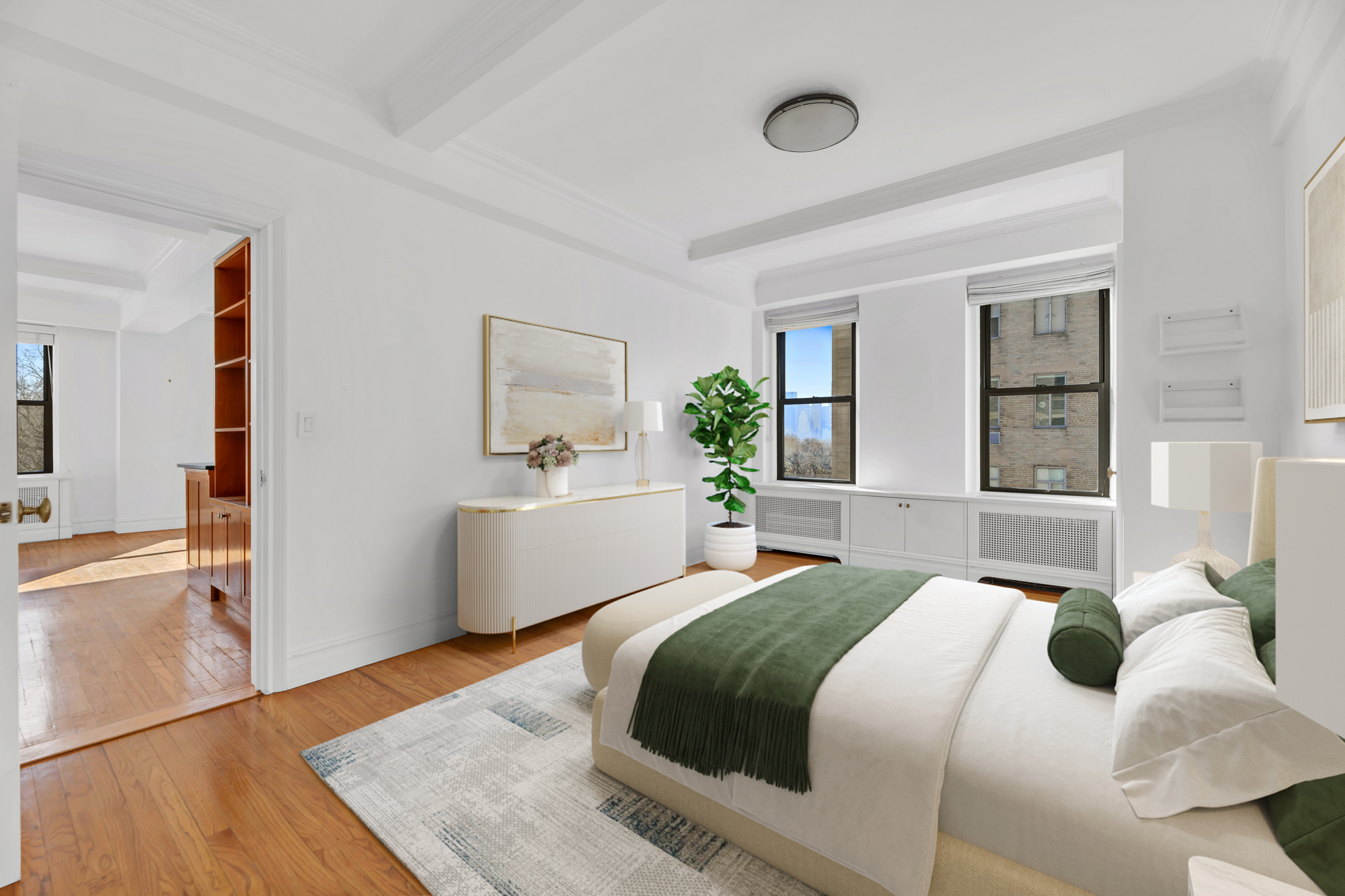 225 Central Park West, Unit 801 Manhattan, NY 10024 - Photo 13 of 21 a bedroom with a large bed and a potted plant