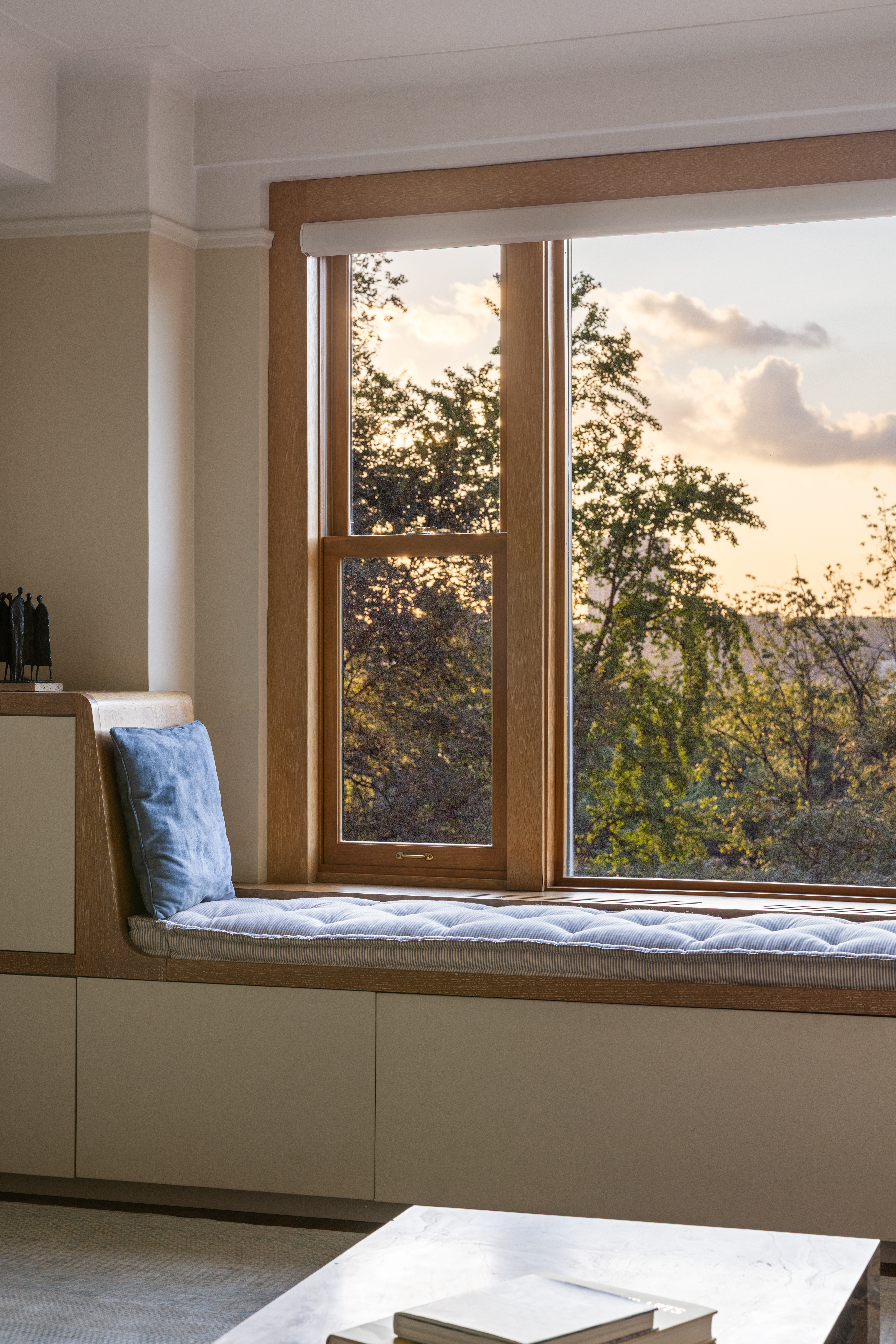 186 Riverside Drive, Unit 5F Manhattan, NY 10024 - Photo 13 of 15 a living room with a large window and a bed