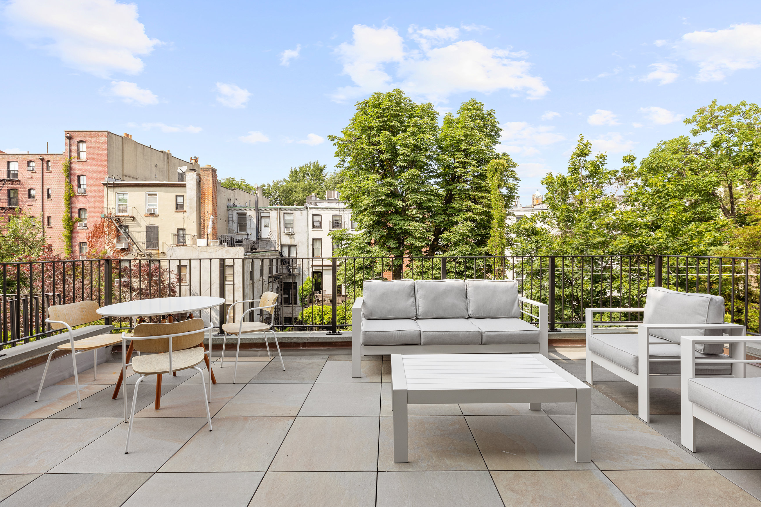 149 Kane Street Brooklyn, NY 11231 - Photo 11 of 26 a view of a terrace with couches and potted plants