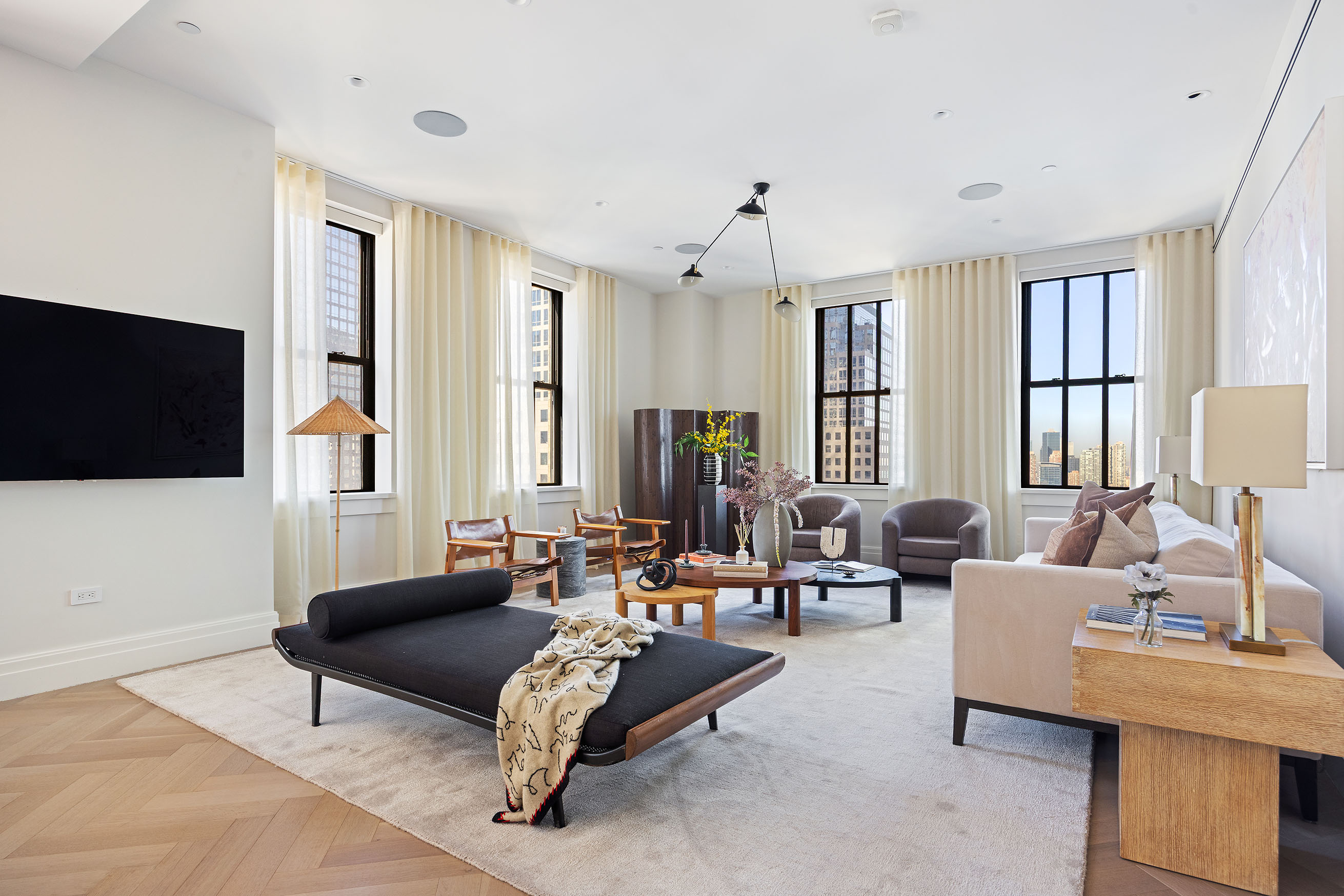 100 Barclay Street, Unit 21AD Manhattan, NY 10007 - Photo 5 of 37 a living room with furniture and a flat screen tv