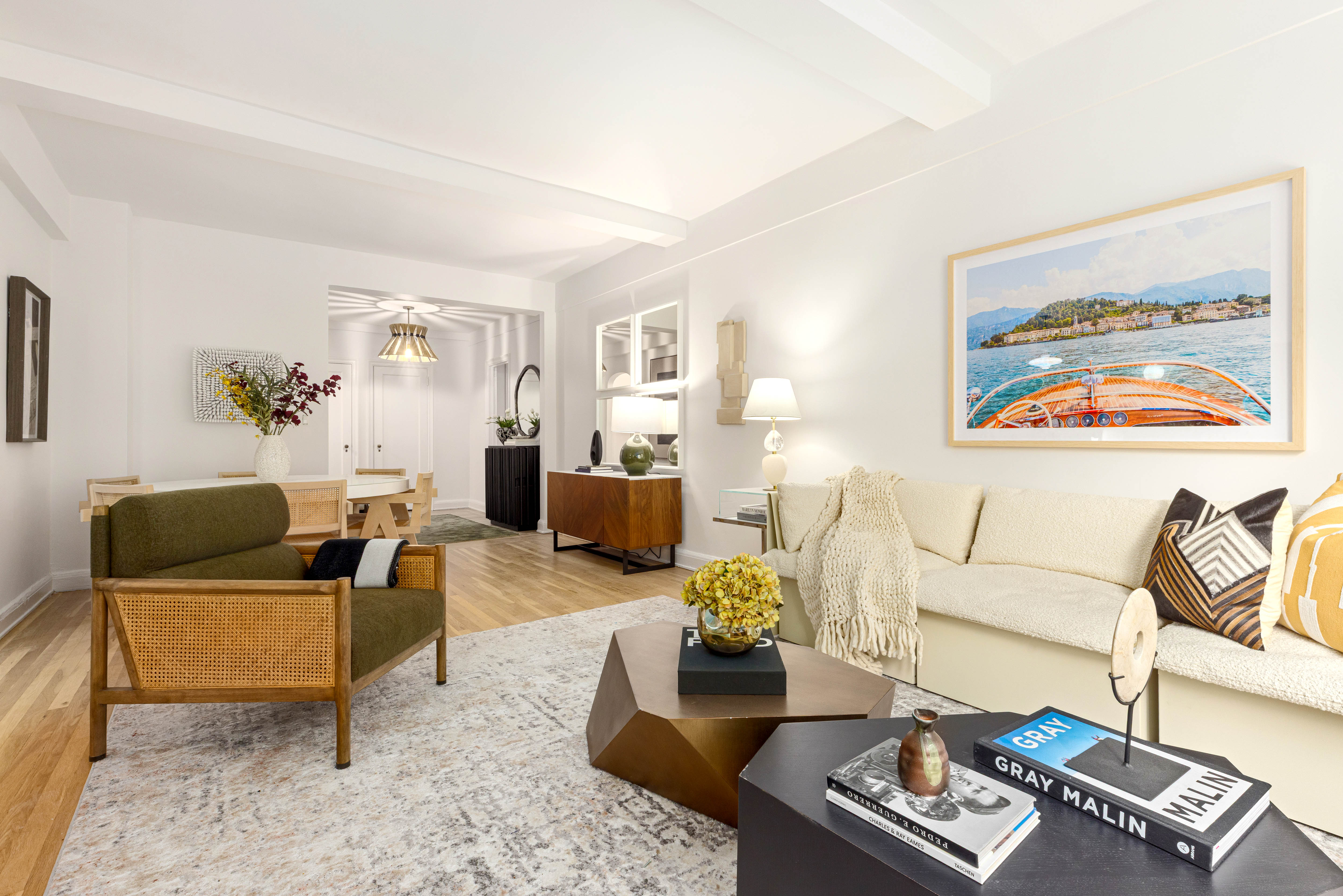 400 East 52nd Street, Unit 10K Manhattan, NY 10022 - Photo 2 of 6 a living room with furniture and a couch