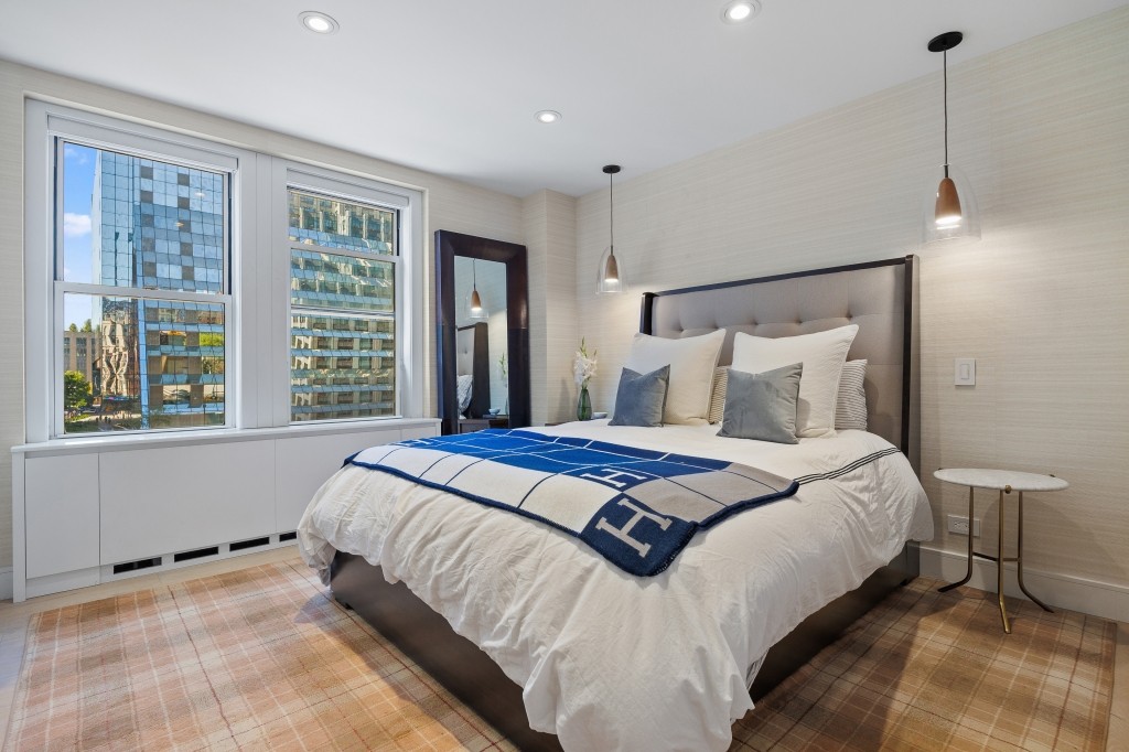 433 West 34th Street, Unit 4ABC Manhattan, NY 10001 - Photo 10 of 20 a bedroom with a bed and large window