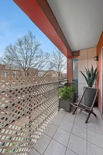 a view of a chairs and table in the patio