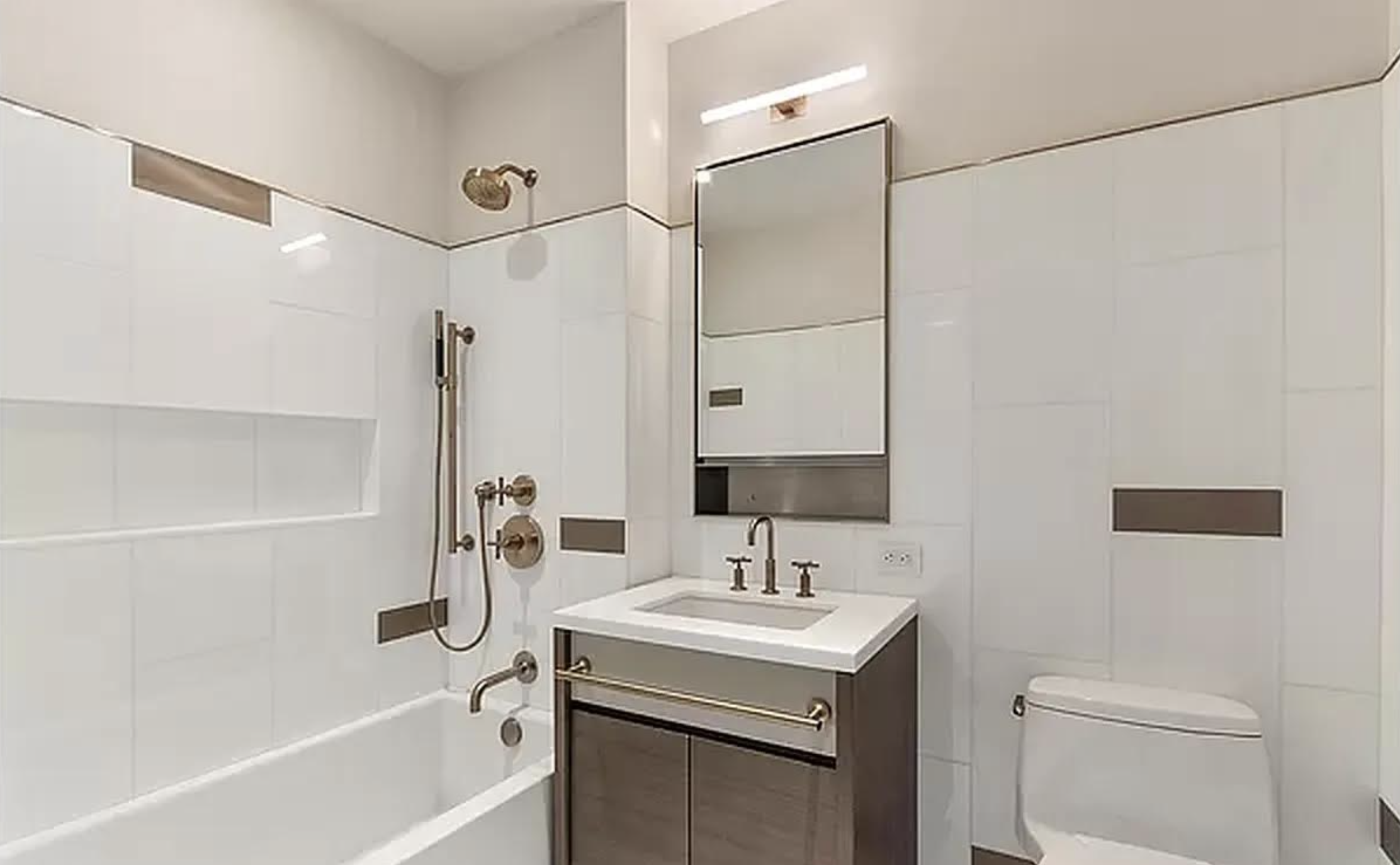 305 East 51st Street, Unit 14F Manhattan, NY 10022 - Photo 12 of 19 a bathroom with a sink toilet and shower