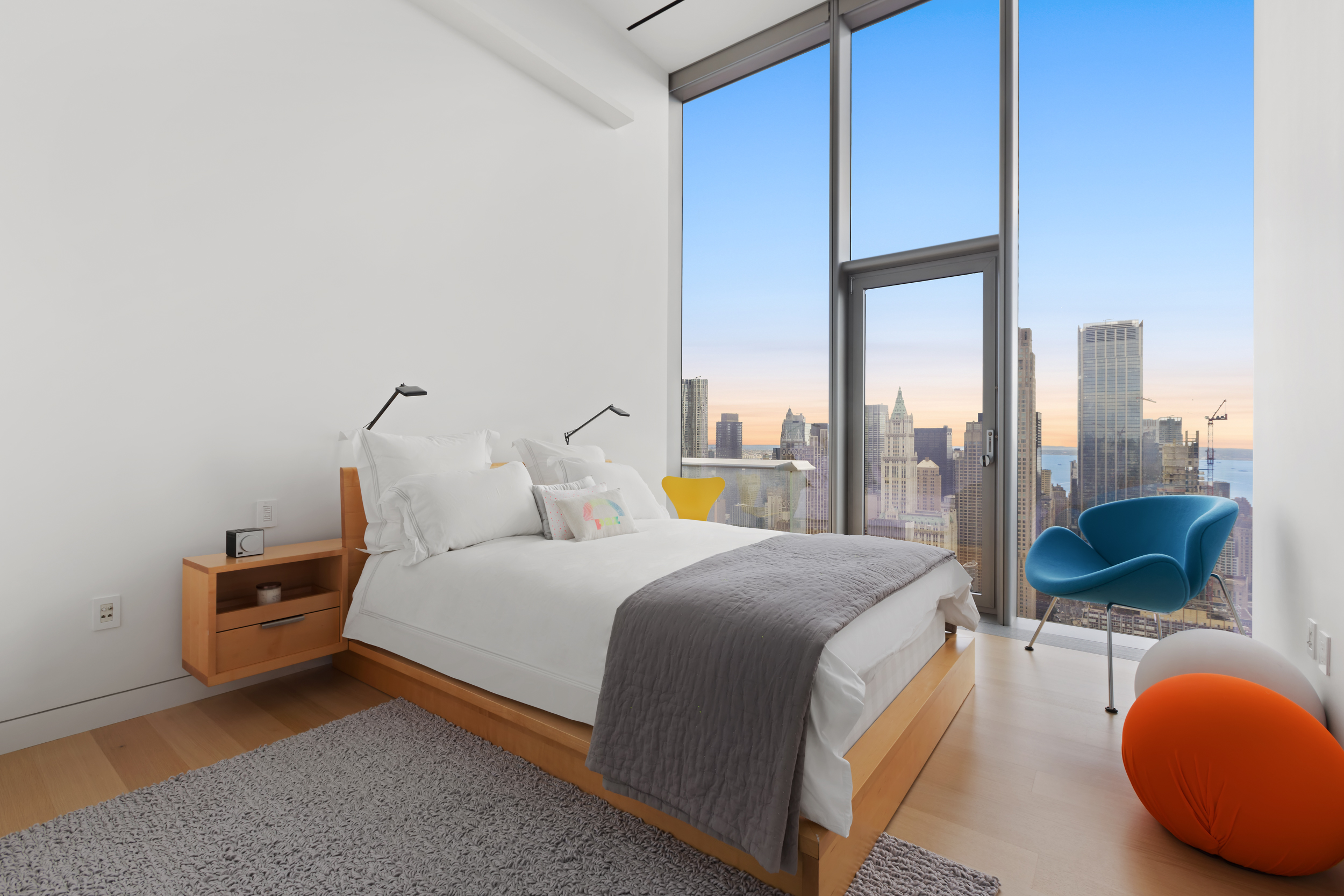 56 Leonard Street, Unit PH52A Manhattan, NY 10013 - Photo 18 of 24 a bedroom with a bed and large windows