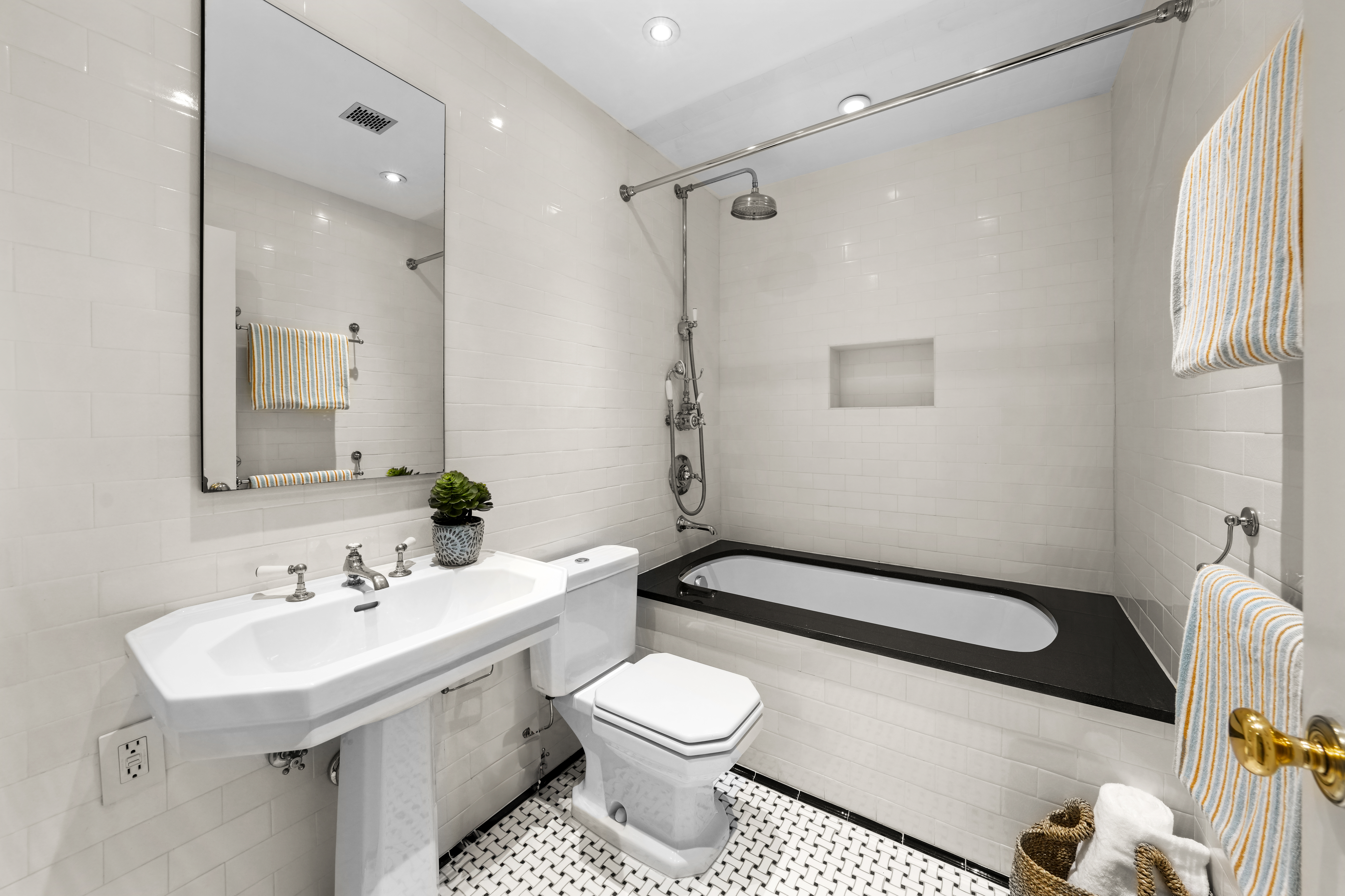 247 East 71st Street Manhattan, NY 10021 - Photo 27 of 31 a bathroom with a sink toilet and shower