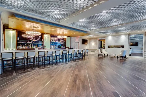 a lobby with furniture and wooden floor