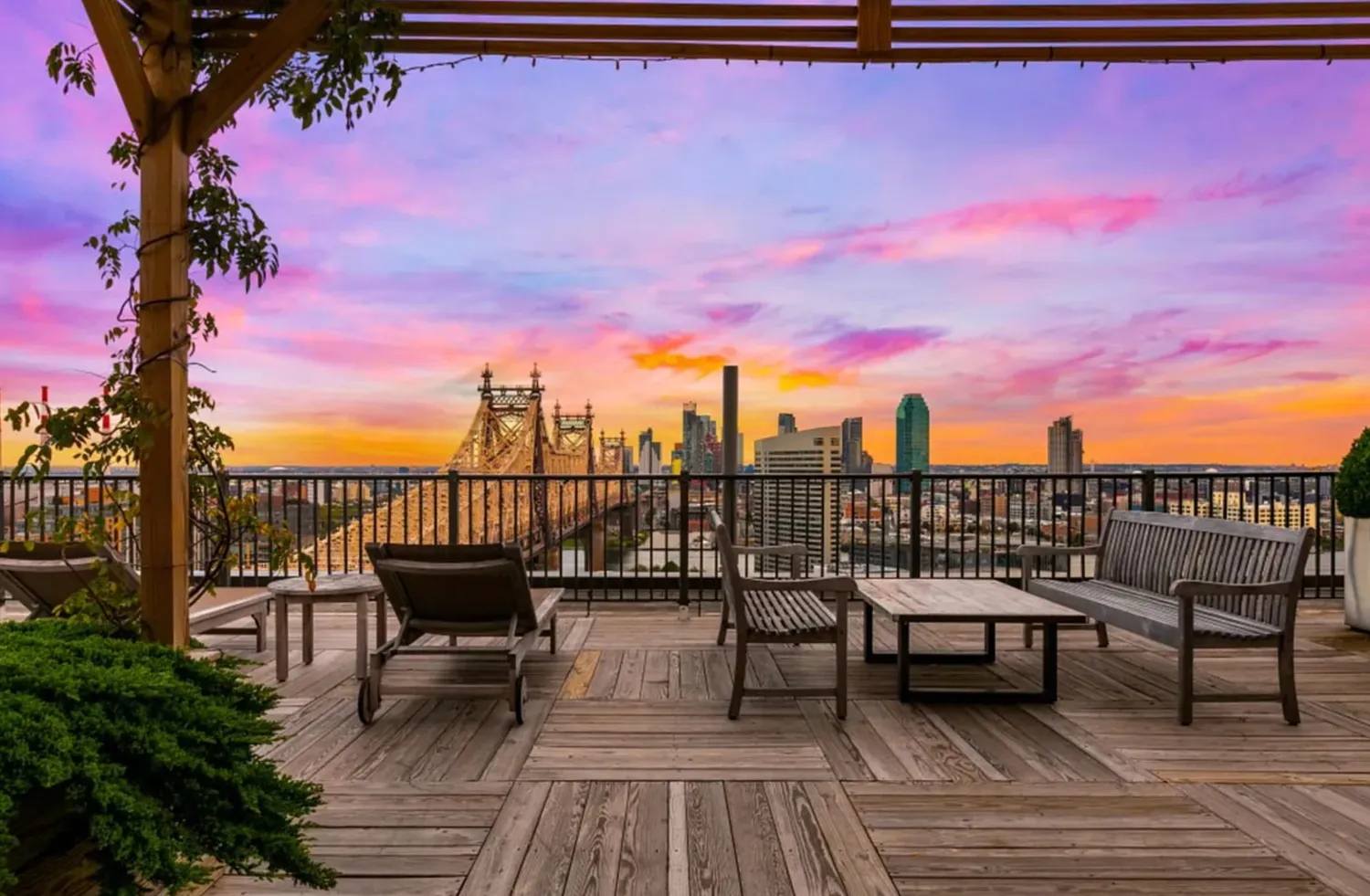 a view of a roof deck with chair and wooden floor