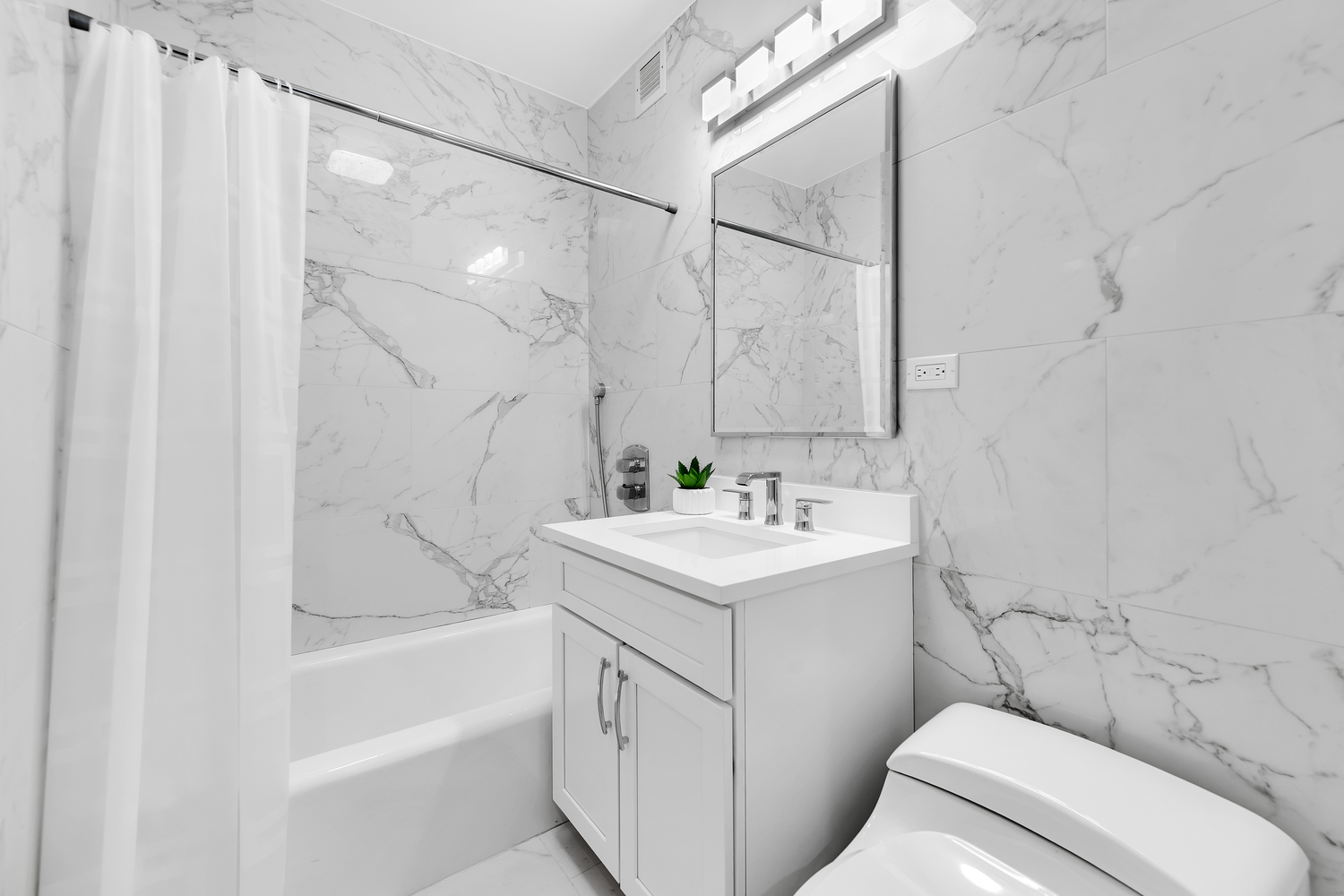 40 East 80th Street, Unit 2C Manhattan, NY 10075 - Photo 5 of 6 a bathroom with a sink toilet and shower