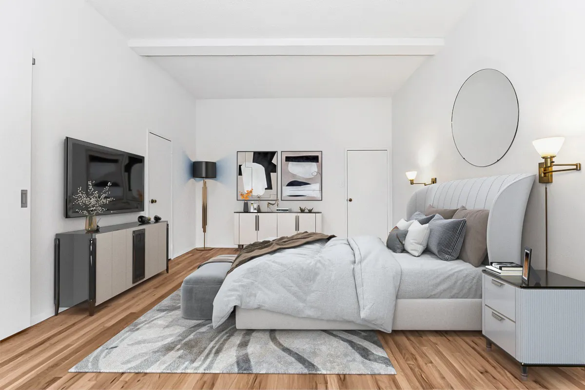 a bedroom with a bed and flat screen tv