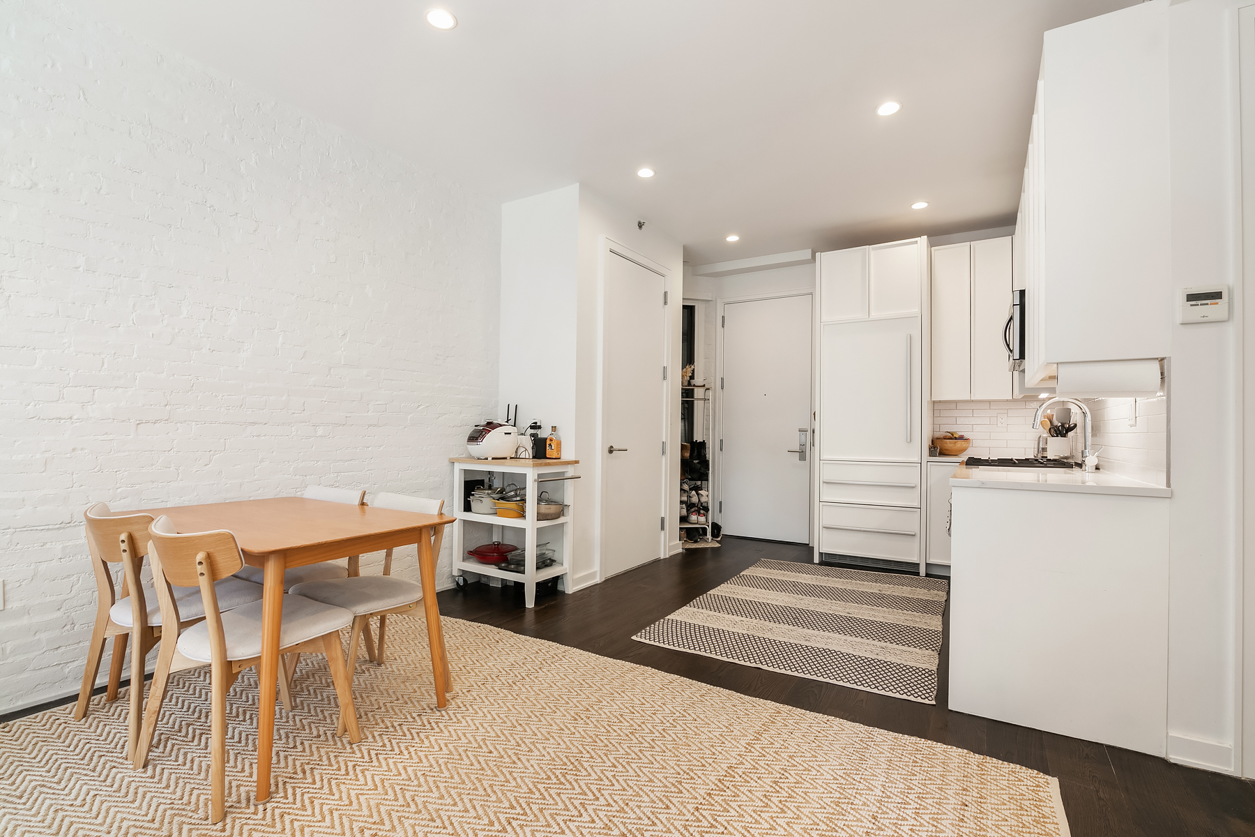 558 West 150th Street, Unit 301 Manhattan, NY 10031 - Photo 2 of 8 a dining room with furniture and wooden floor