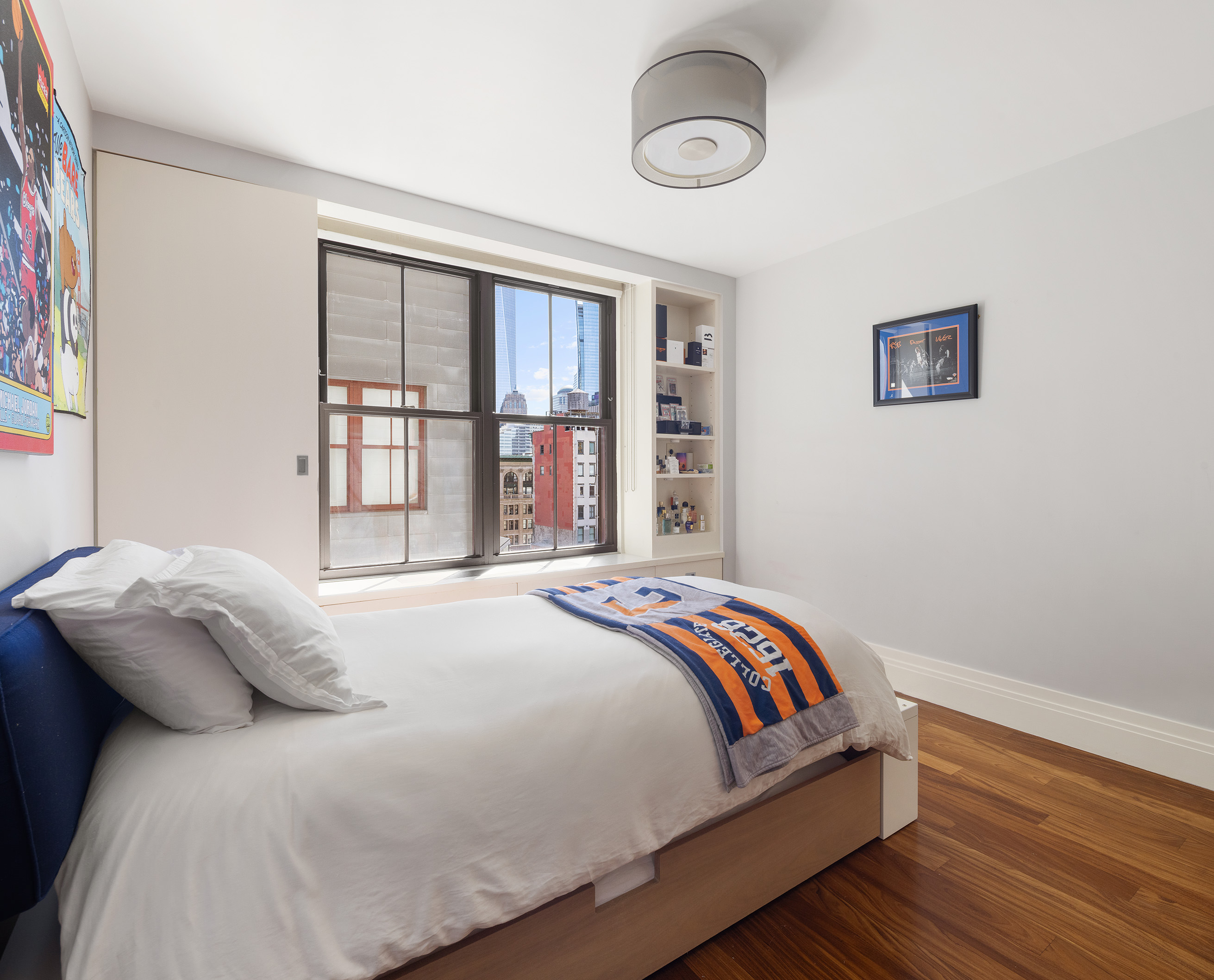 27 North Moore Street, Unit 10D Manhattan, NY 10013 - Photo 22 of 30 a bedroom with a bed and a window