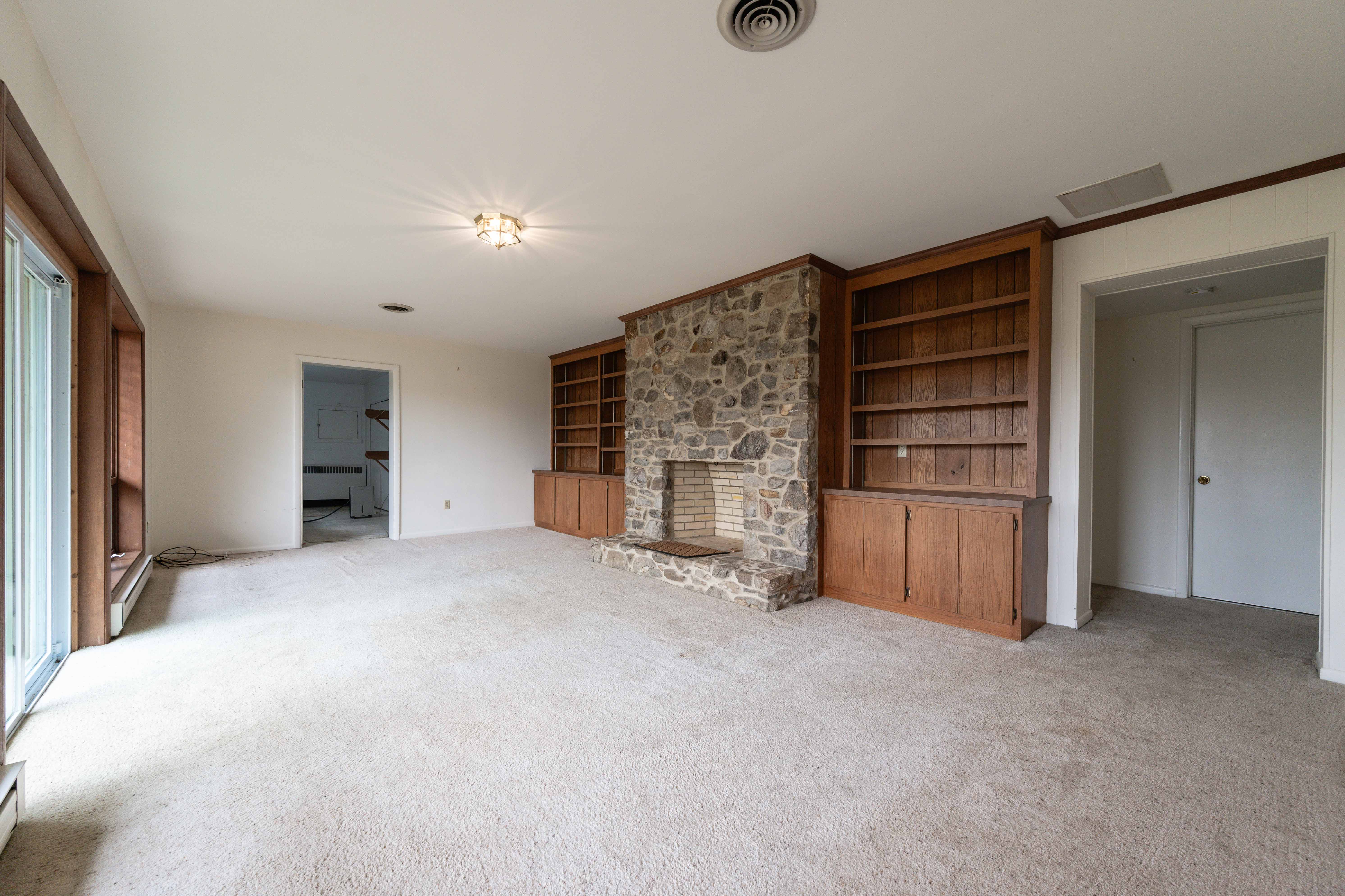 21730 Peach Tree Road Dickerson, MD 20842 - Photo 5 of 11 a view of an empty room with a fireplace and windows