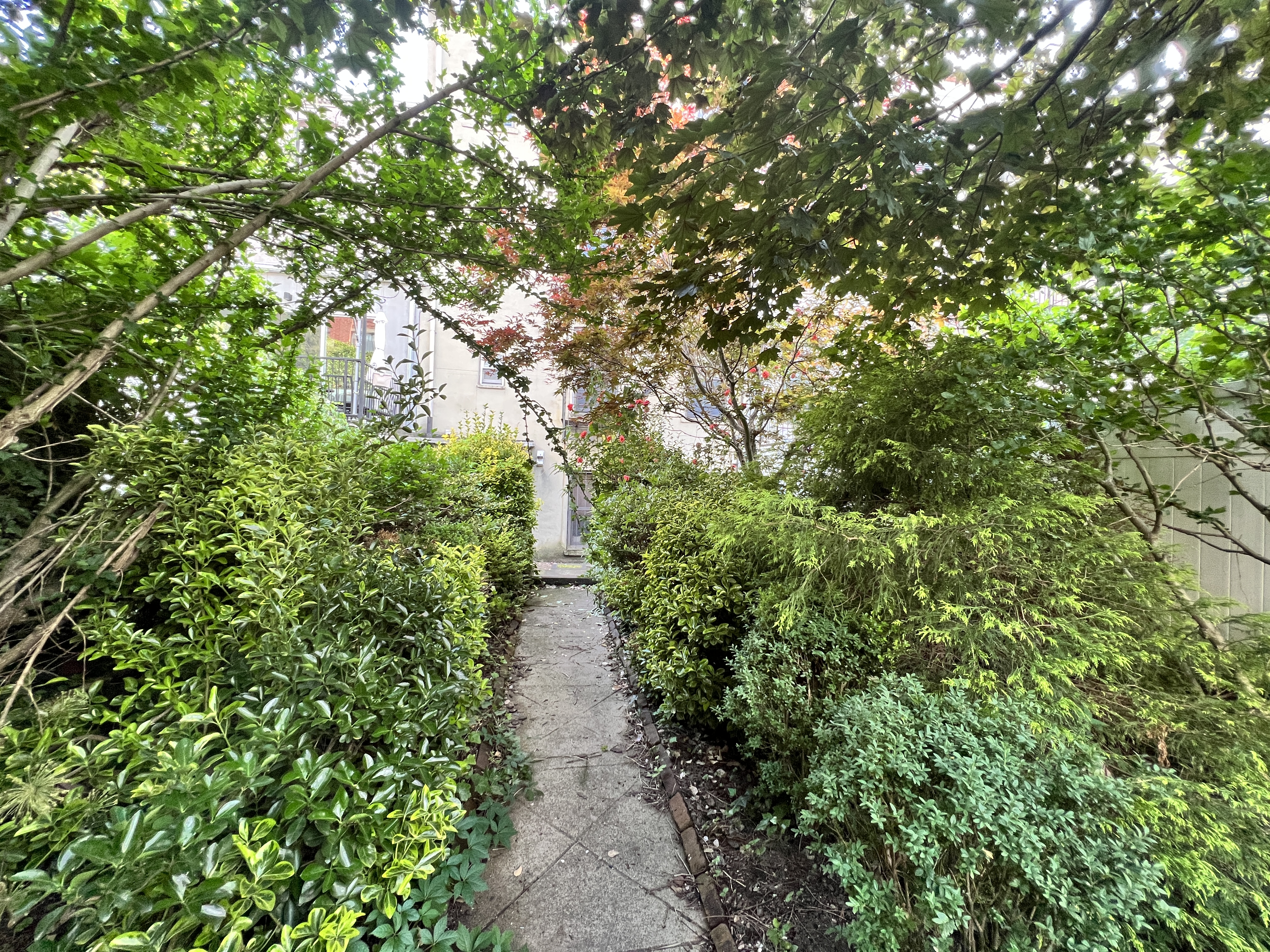 75 Warren Street, Unit 1 Brooklyn, NY 11201 - Photo 14 of 14 a view of a garden with large trees