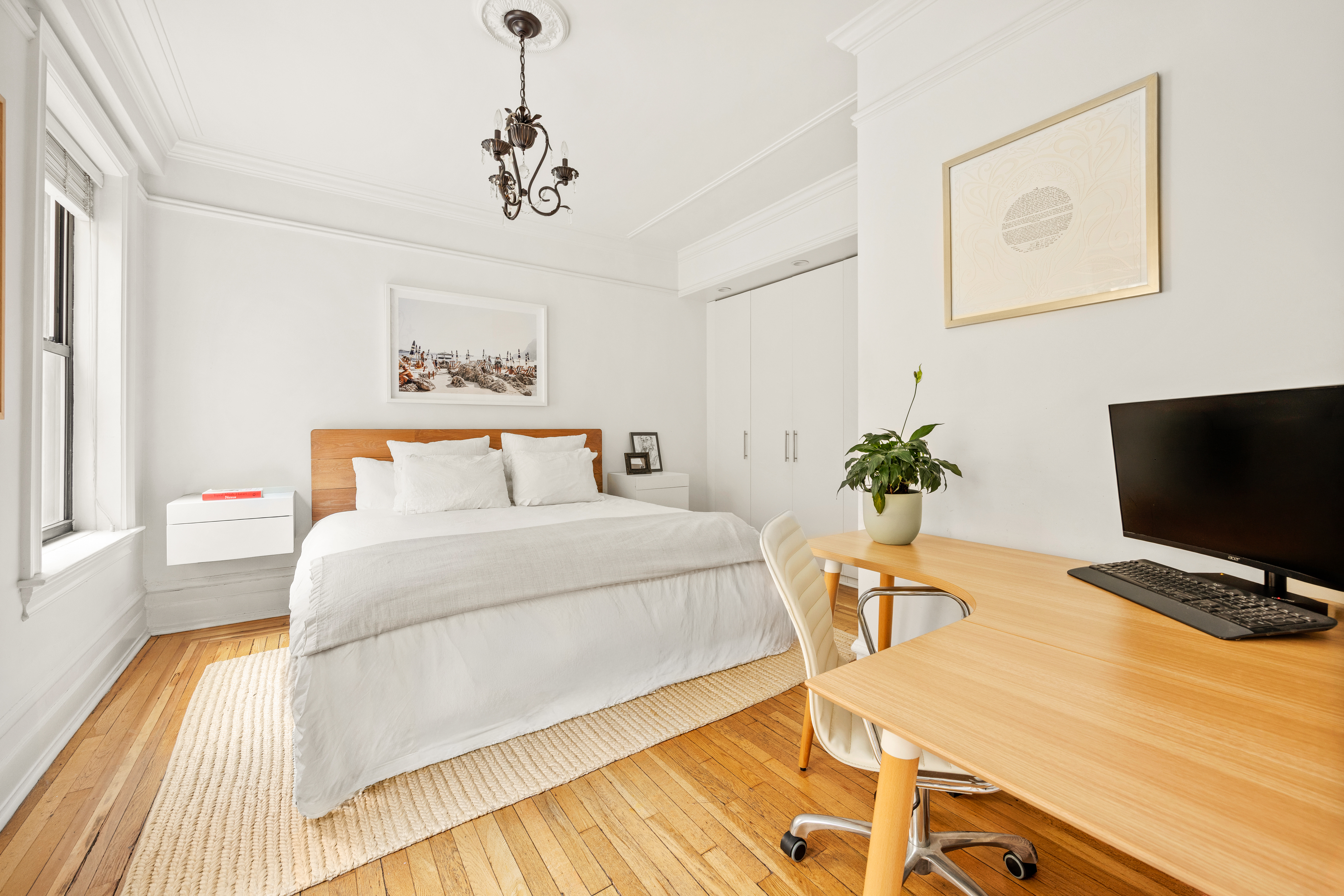 150 West 87th Street, Unit 7C Manhattan, NY 10024 - Photo 9 of 18 a bedroom with a bed and a flat screen tv