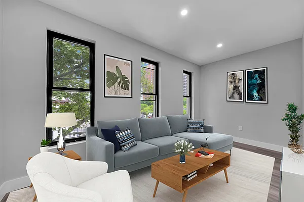 a living room with furniture and a window