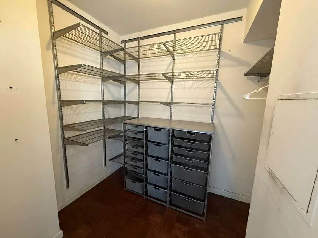 275 Greenwich Street, Unit 11G Manhattan, NY 10007 - Photo 16 of 18 a view of walk in closet with empty racks