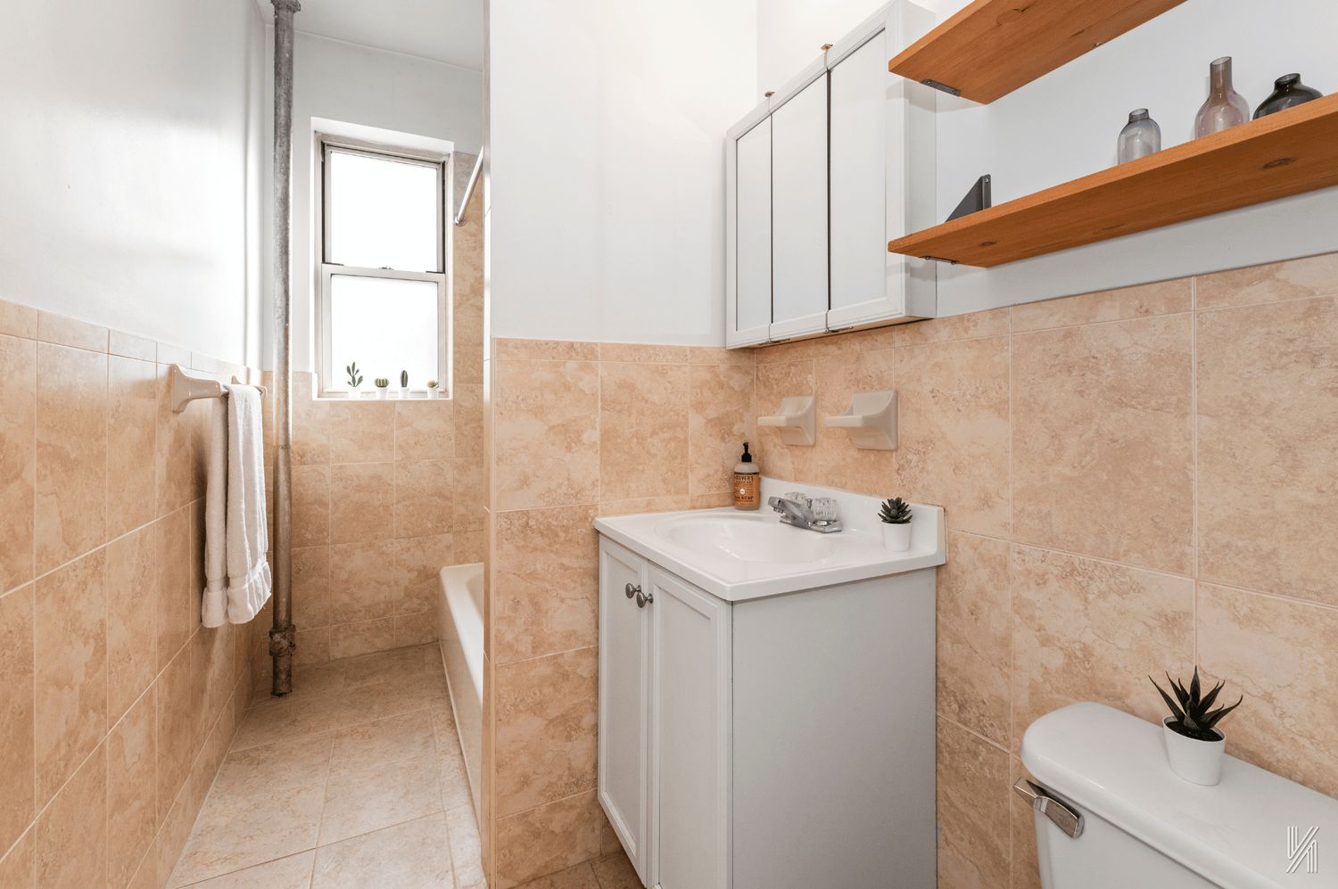 59-11 Queens Boulevard, Unit 3J Queens, NY 11377 - Photo 14 of 18 a utility room with a sink a washer and dryer