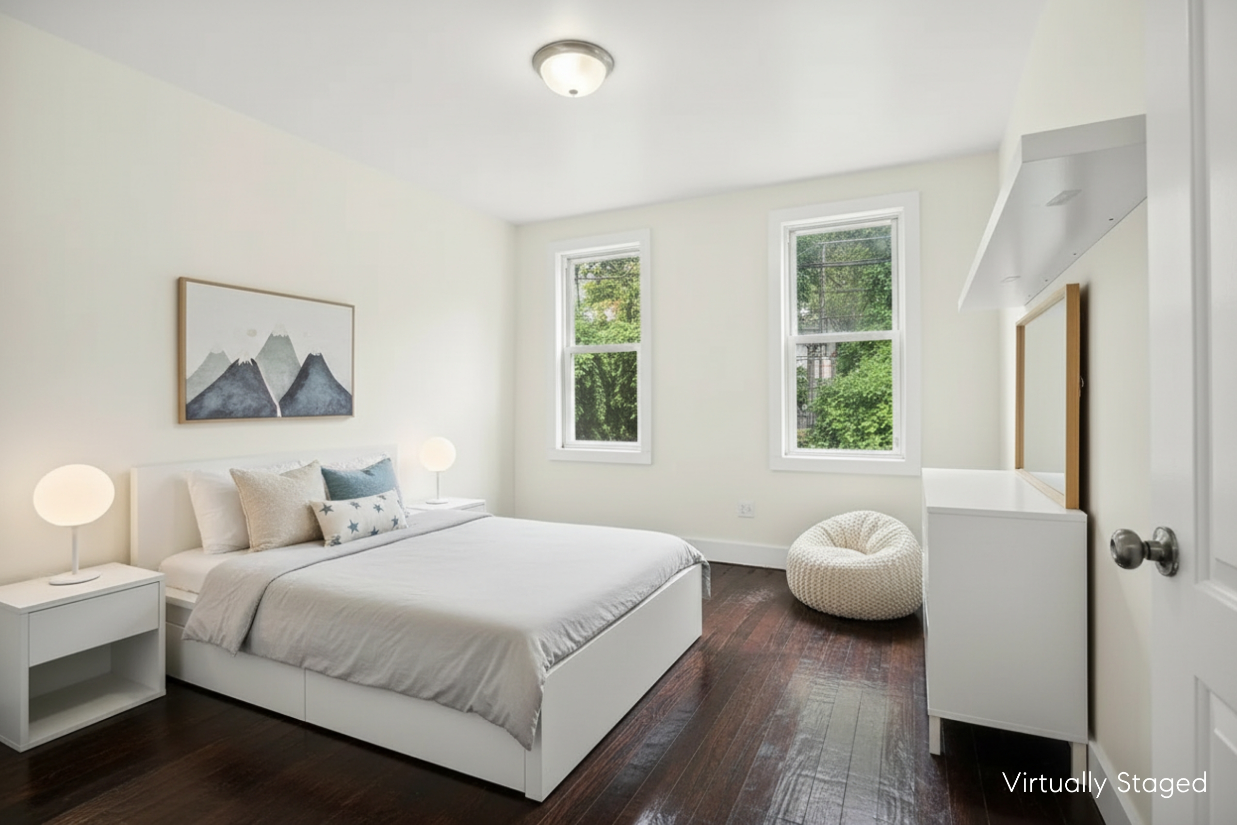 22-42 41st Street, Unit 2R Queens, NY 11105 - Photo 8 of 10 a bedroom with a bed and wooden floor