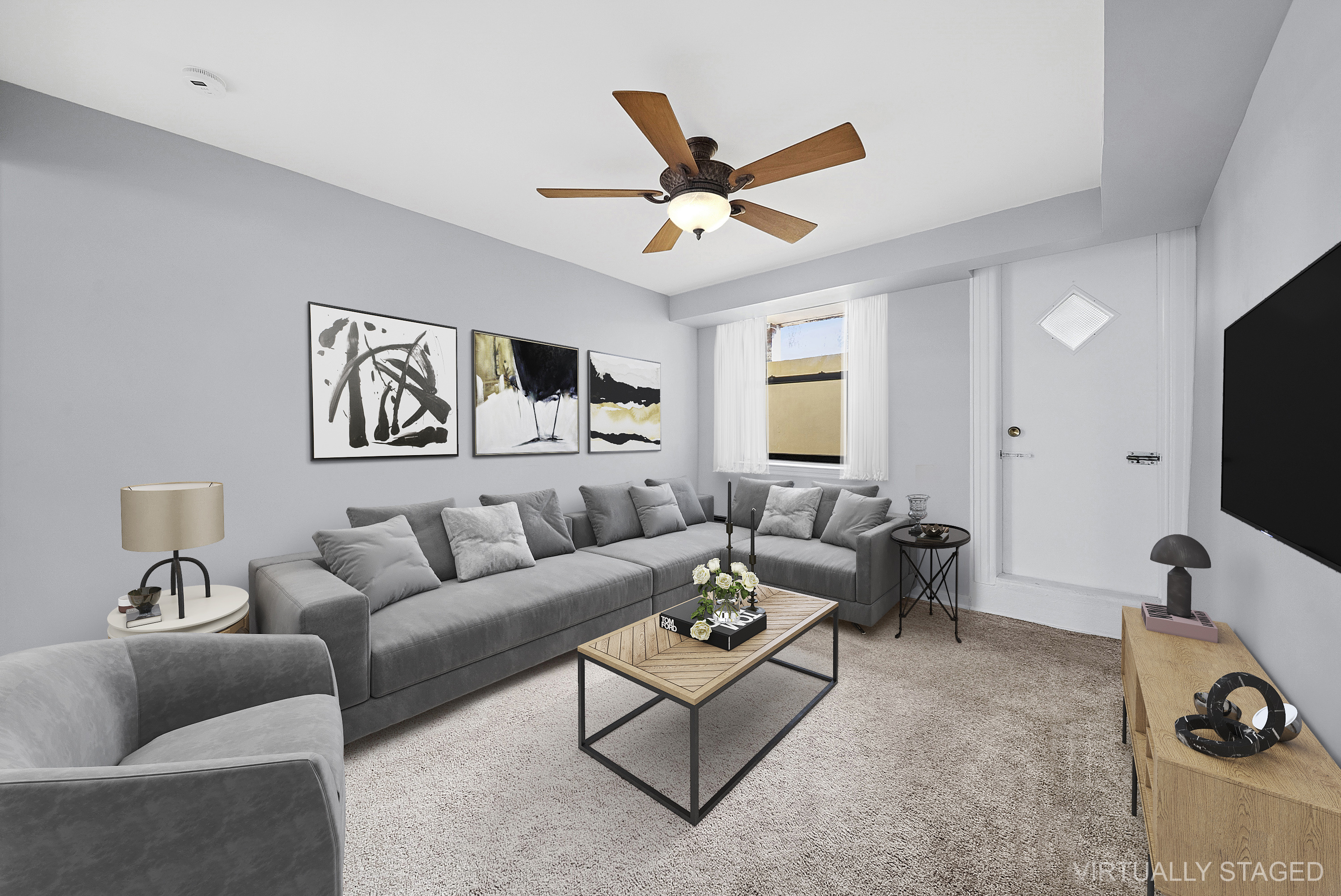 203 Battery Avenue Brooklyn, NY 11209 - Photo 9 of 14 a living room with furniture a ceiling fan and a window
