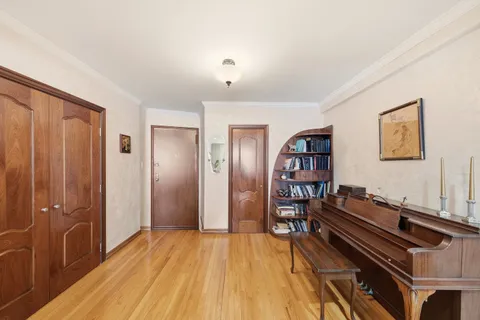 a view of a livingroom with furniture and staircase