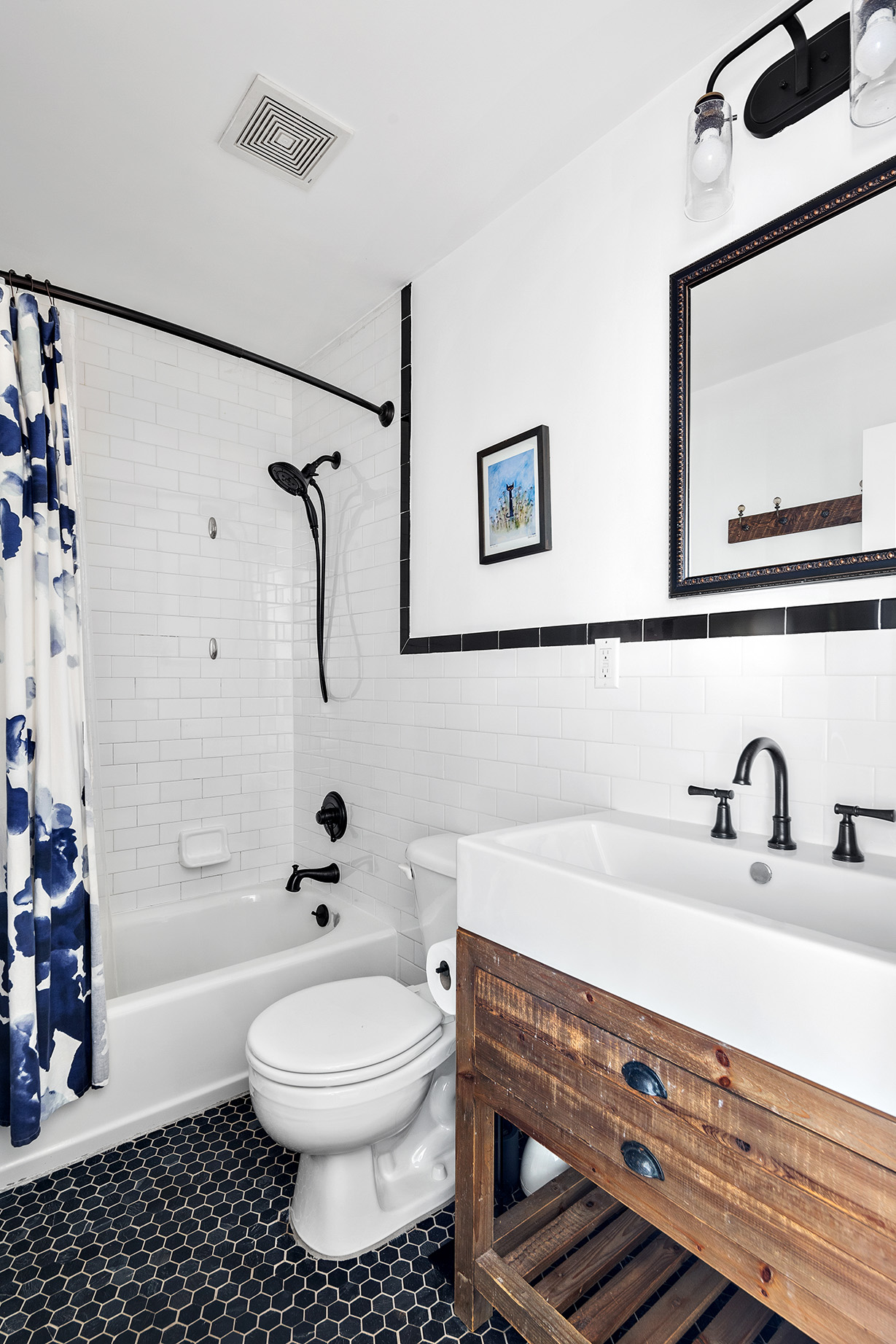 232 Monroe Street Brooklyn, NY 11216 - Photo 12 of 21 a bathroom with a sink a toilet and shower