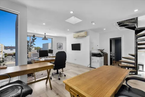 a room with furniture and a flat screen tv