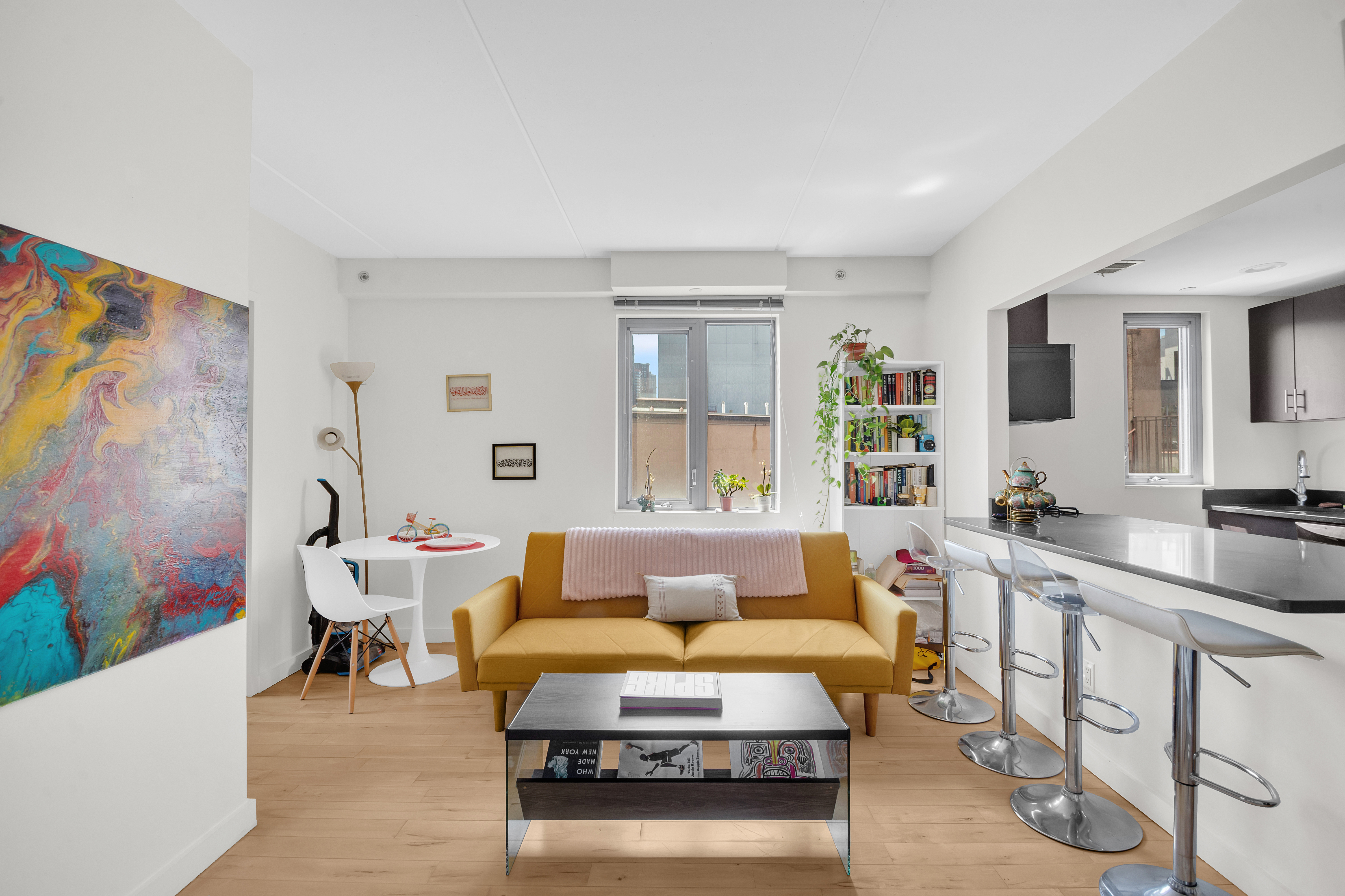 1810 3rd Avenue, Unit A7D Manhattan, NY 10029 - Photo 3 of 13 a living room with furniture and painting on the wall