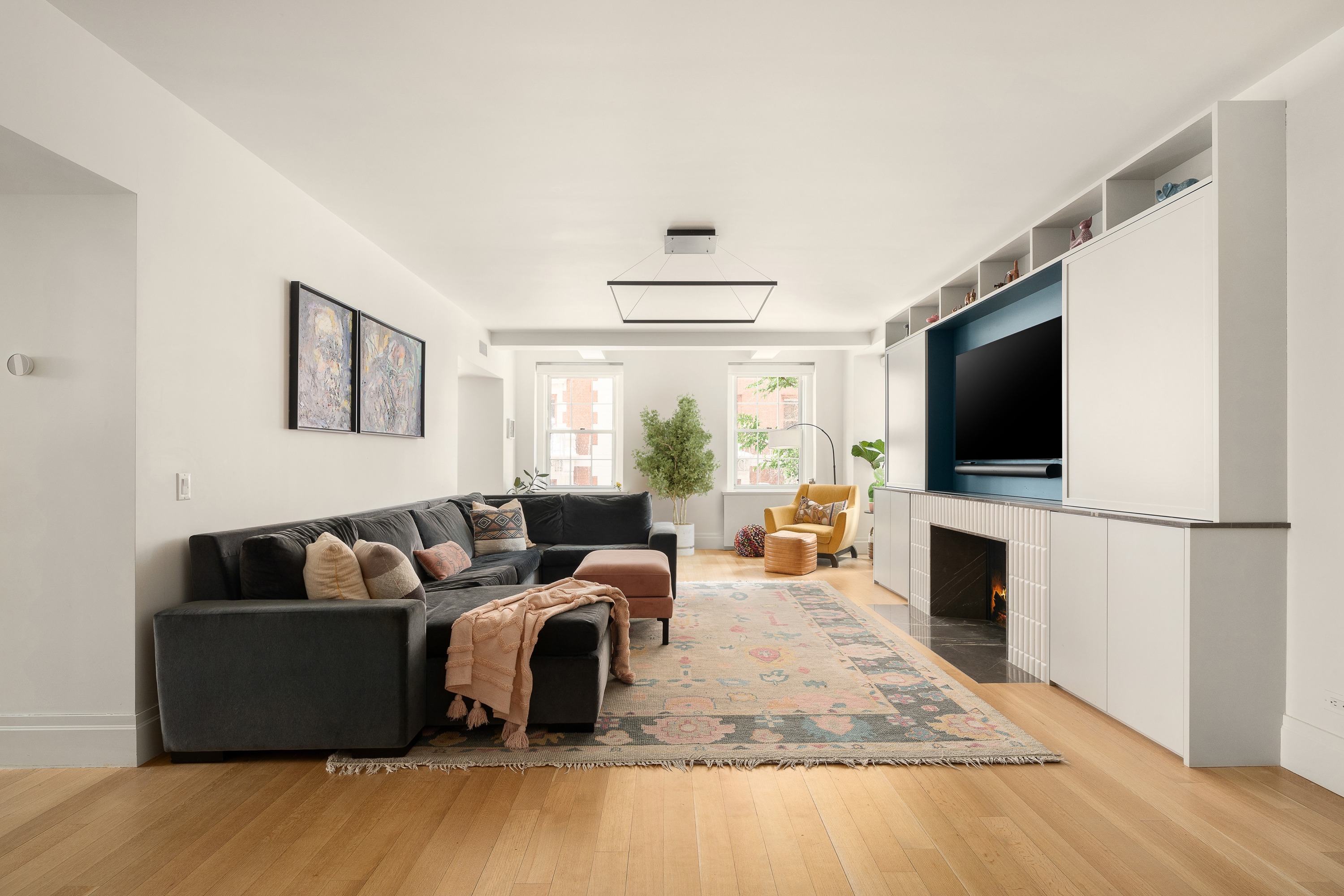 160 Henry Street, Unit 3C Brooklyn, NY 11201 - Photo 2 of 18 a living room with fireplace furniture and a flat screen tv
