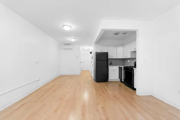 a view of kitchen with wooden floor