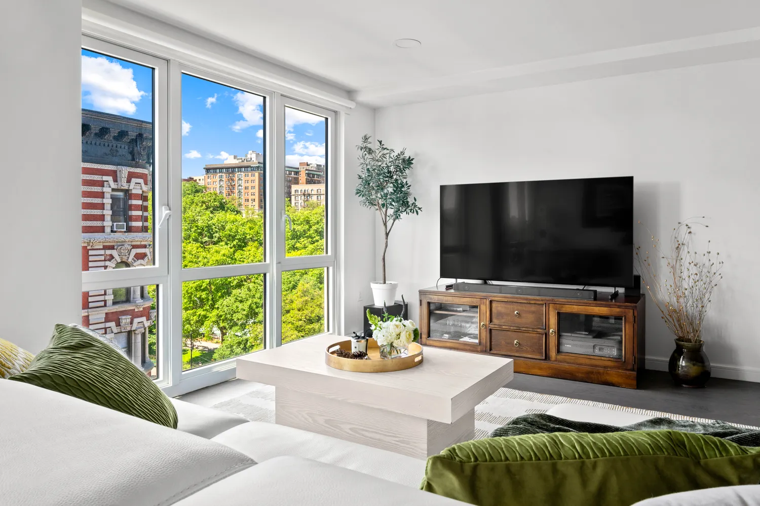a living room with furniture and a flat screen tv