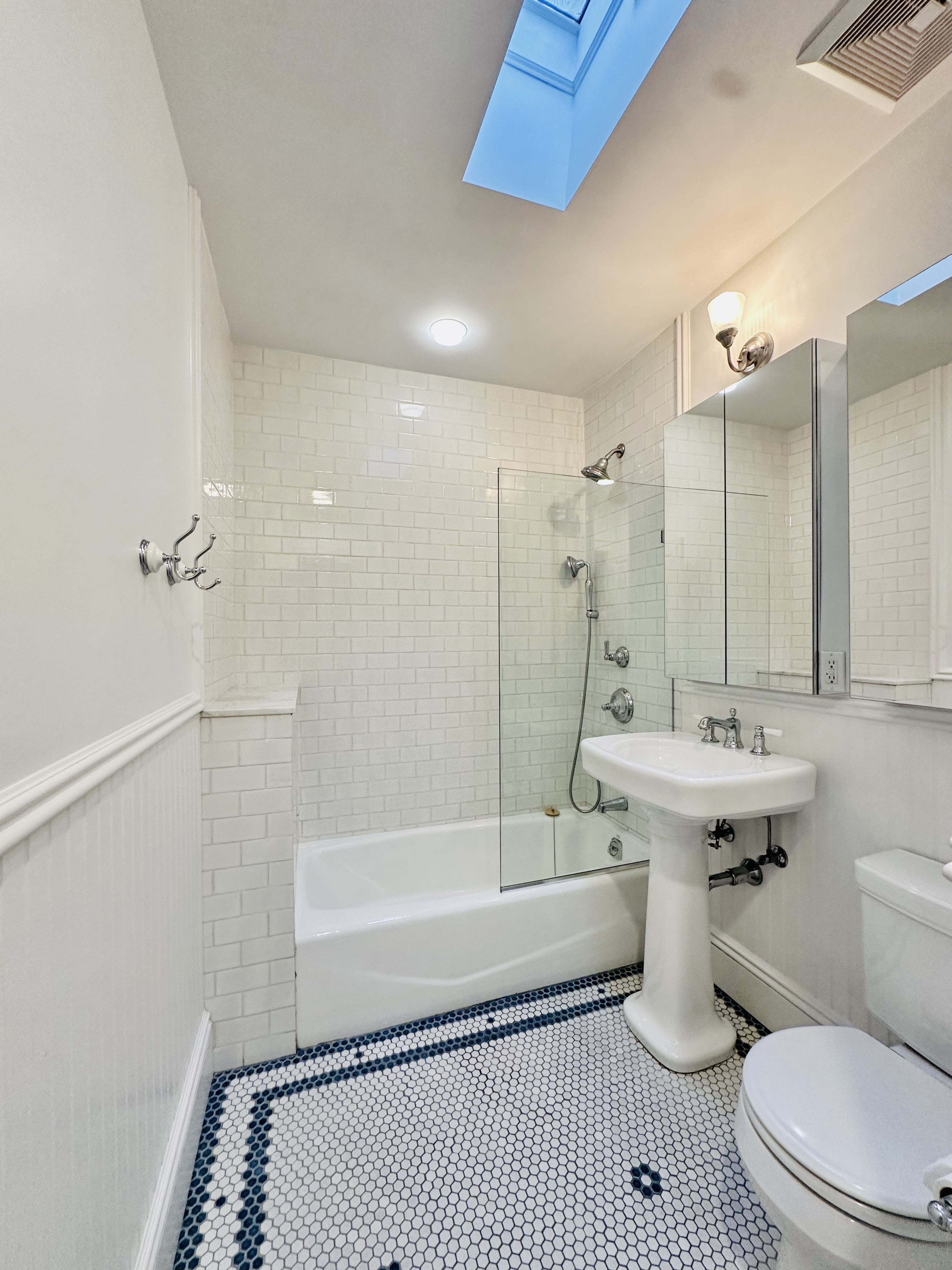 446 Sackett Street Brooklyn, NY 11231 - Photo 11 of 15 a bathroom with a sink a toilet and shower