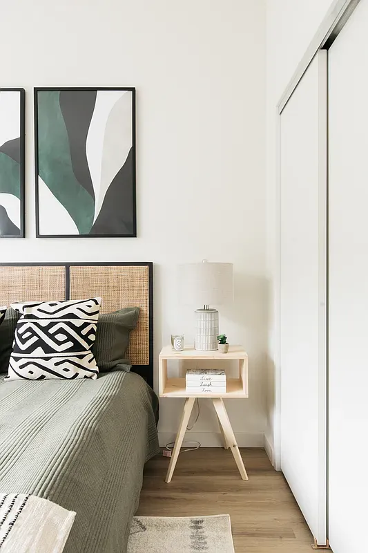 a bedroom with a bed and window