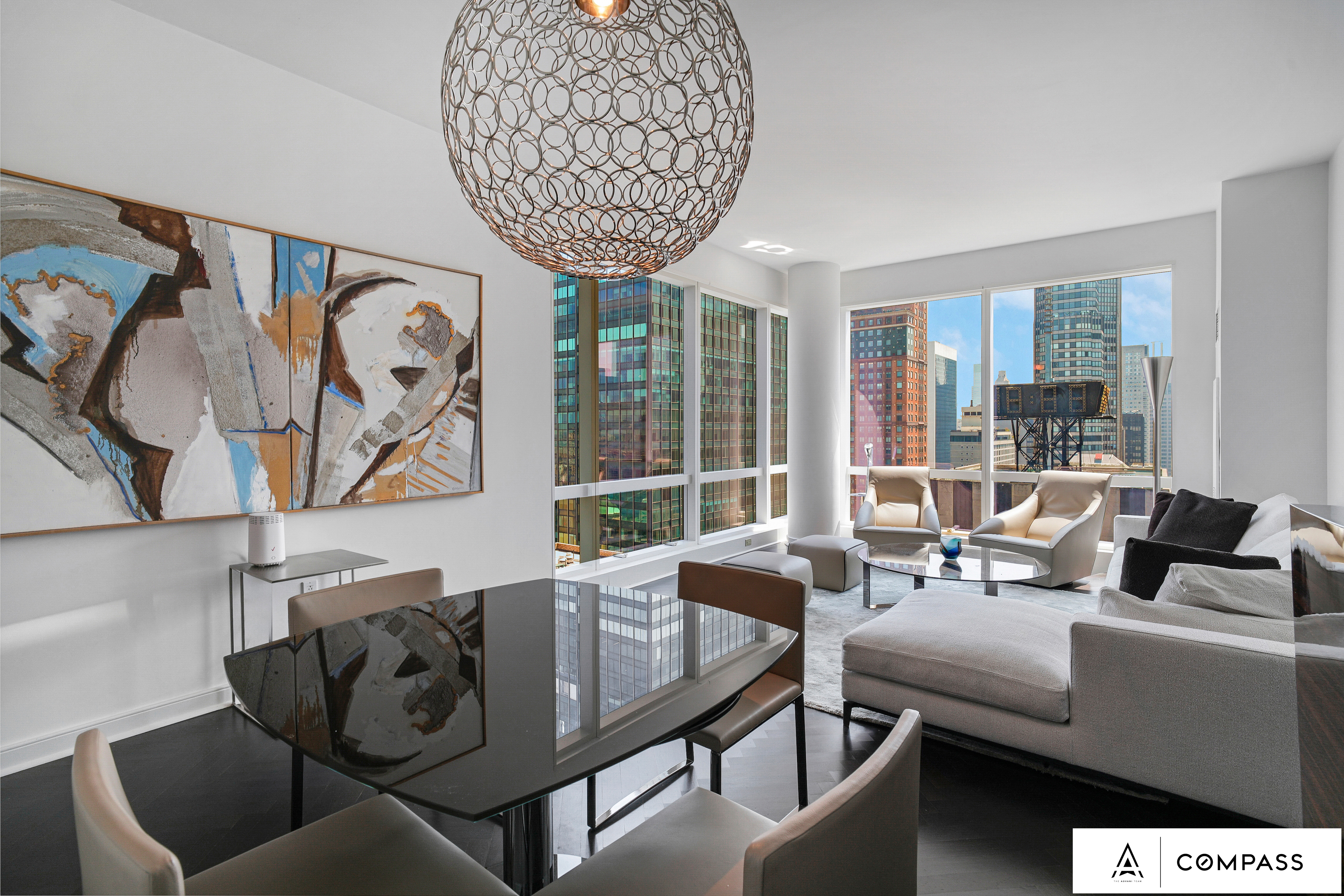 230 West 56th Street, Unit 49C Manhattan, NY 10019 - Photo 2 of 14 a living room with furniture and a large window