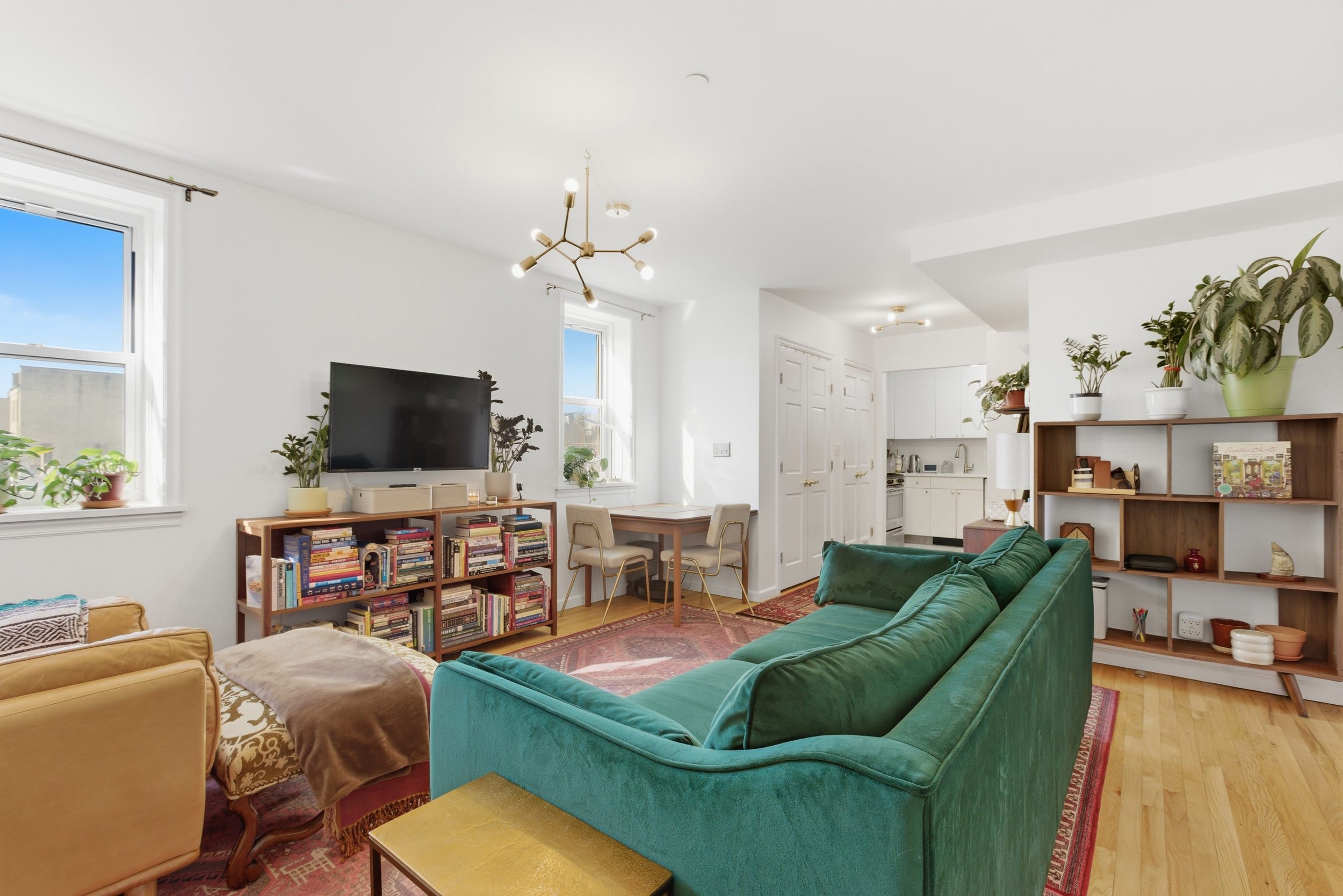 392 11th Street, Unit 3A Brooklyn, NY 11215 - Photo 7 of 11 a living room with furniture and a flat screen tv
