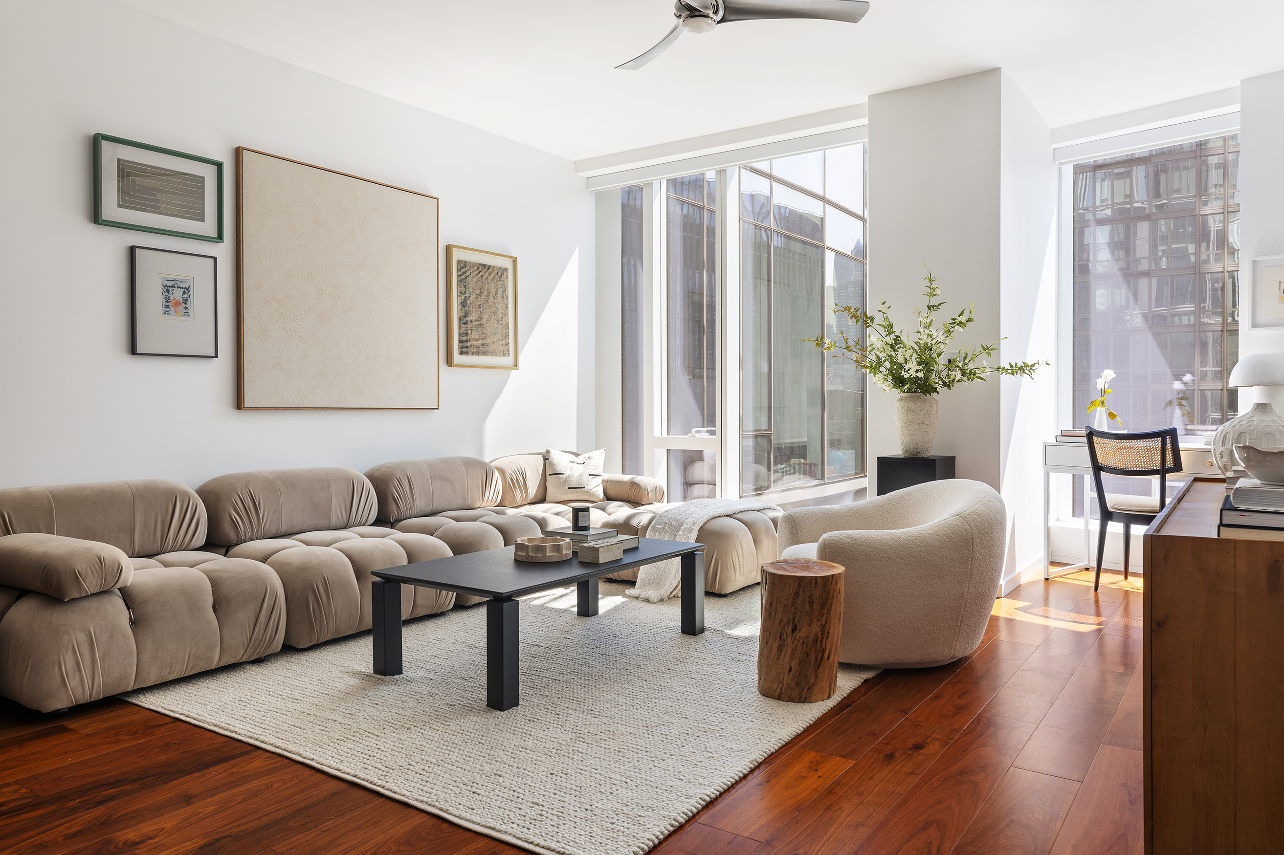 1 West End Avenue, Unit 15E Manhattan, NY 10023 - Photo 2 of 31 a living room with furniture and wooden floor