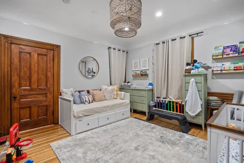 a living room with furniture and a clock