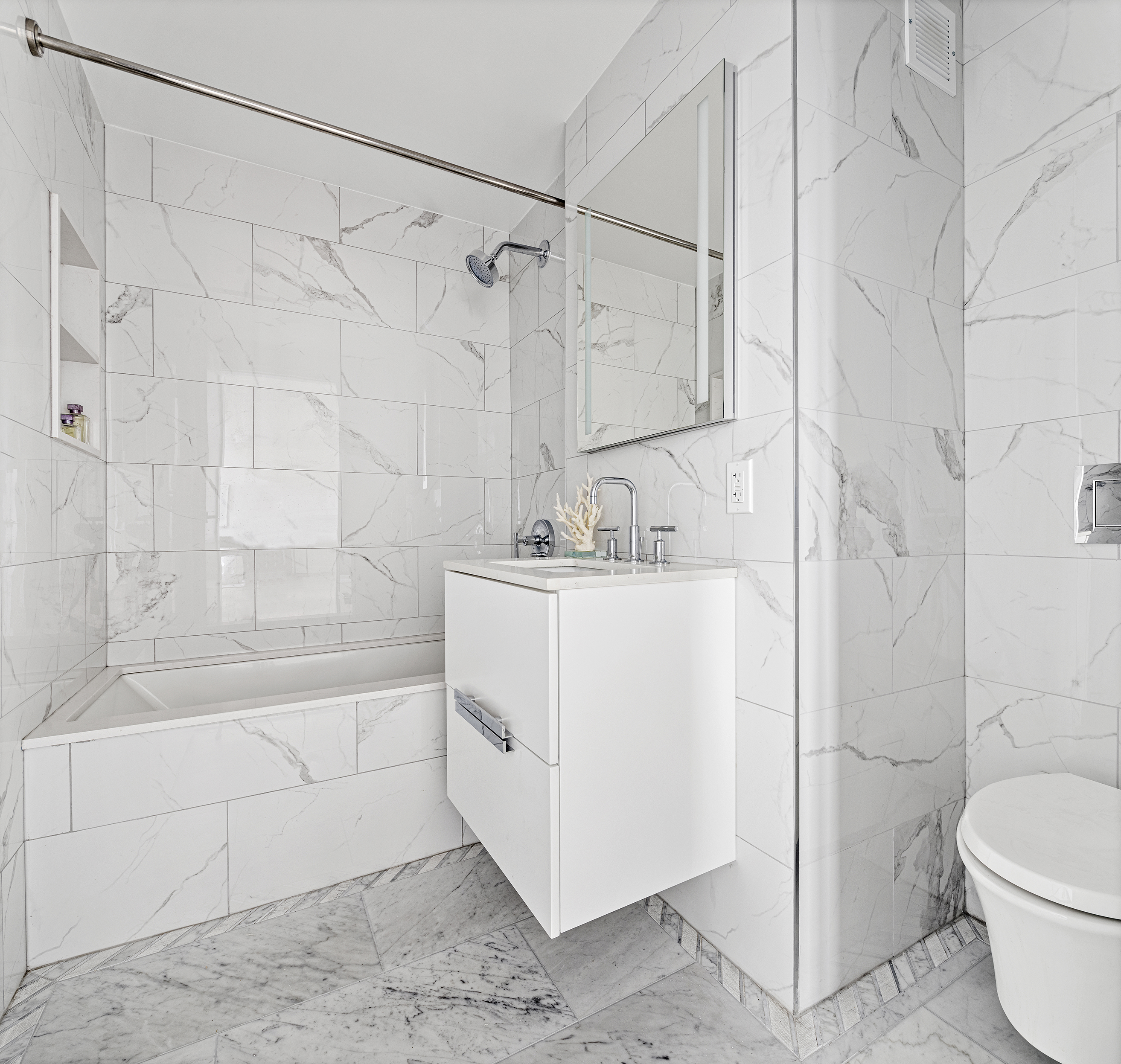 175 West 95th Street, Unit 26A Manhattan, NY 10025 - Photo 7 of 12 a bathroom with a sink a toilet and shower