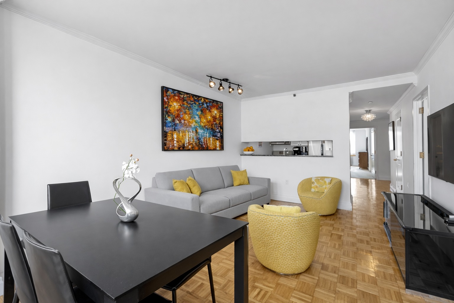 404 East 76th Street, Unit 6K Manhattan, NY 10021 - Photo 2 of 12 a living room with furniture and a table