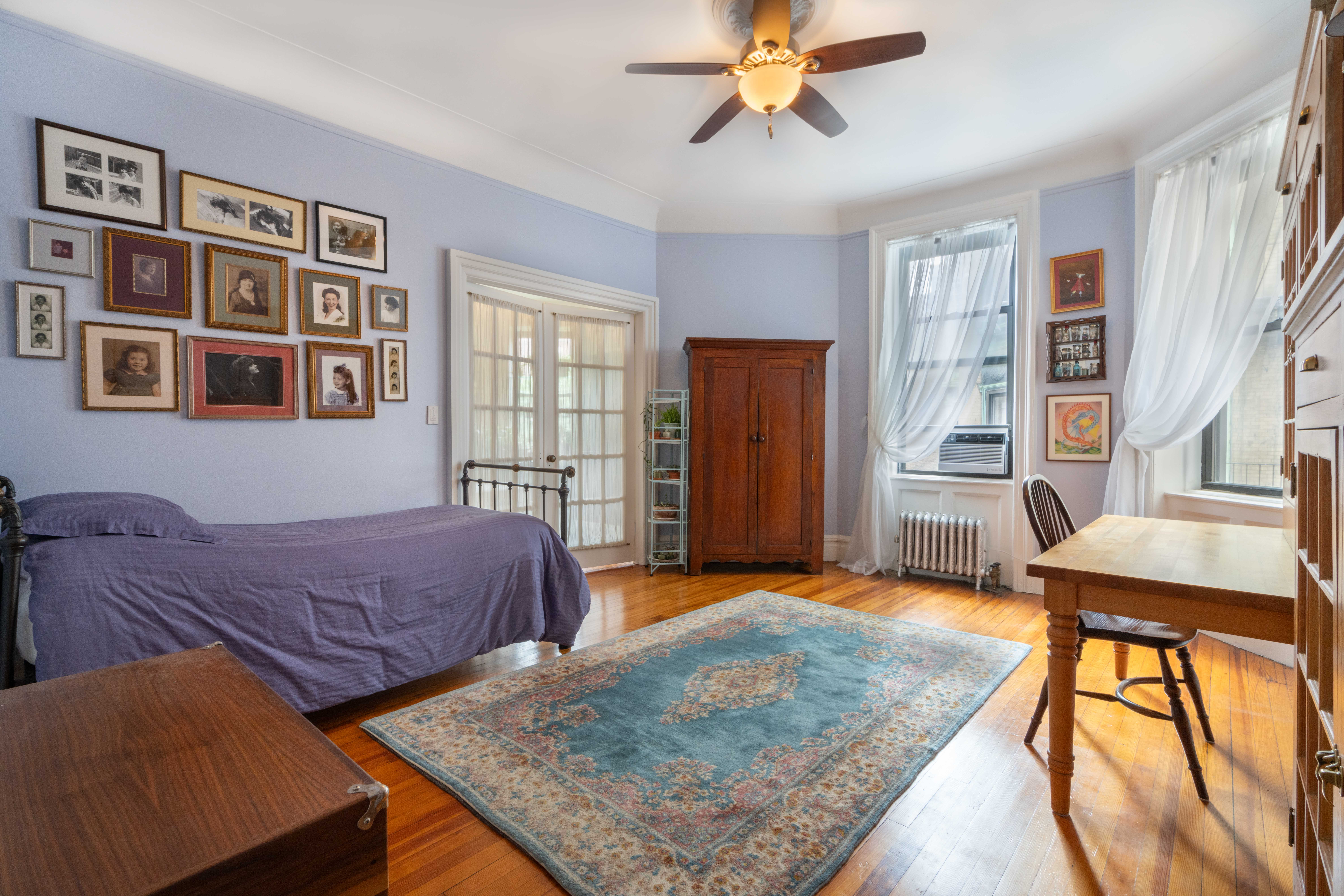 194 Riverside Drive, Unit 4B Manhattan, NY 10025 - Photo 4 of 17 a living room with furniture and a window