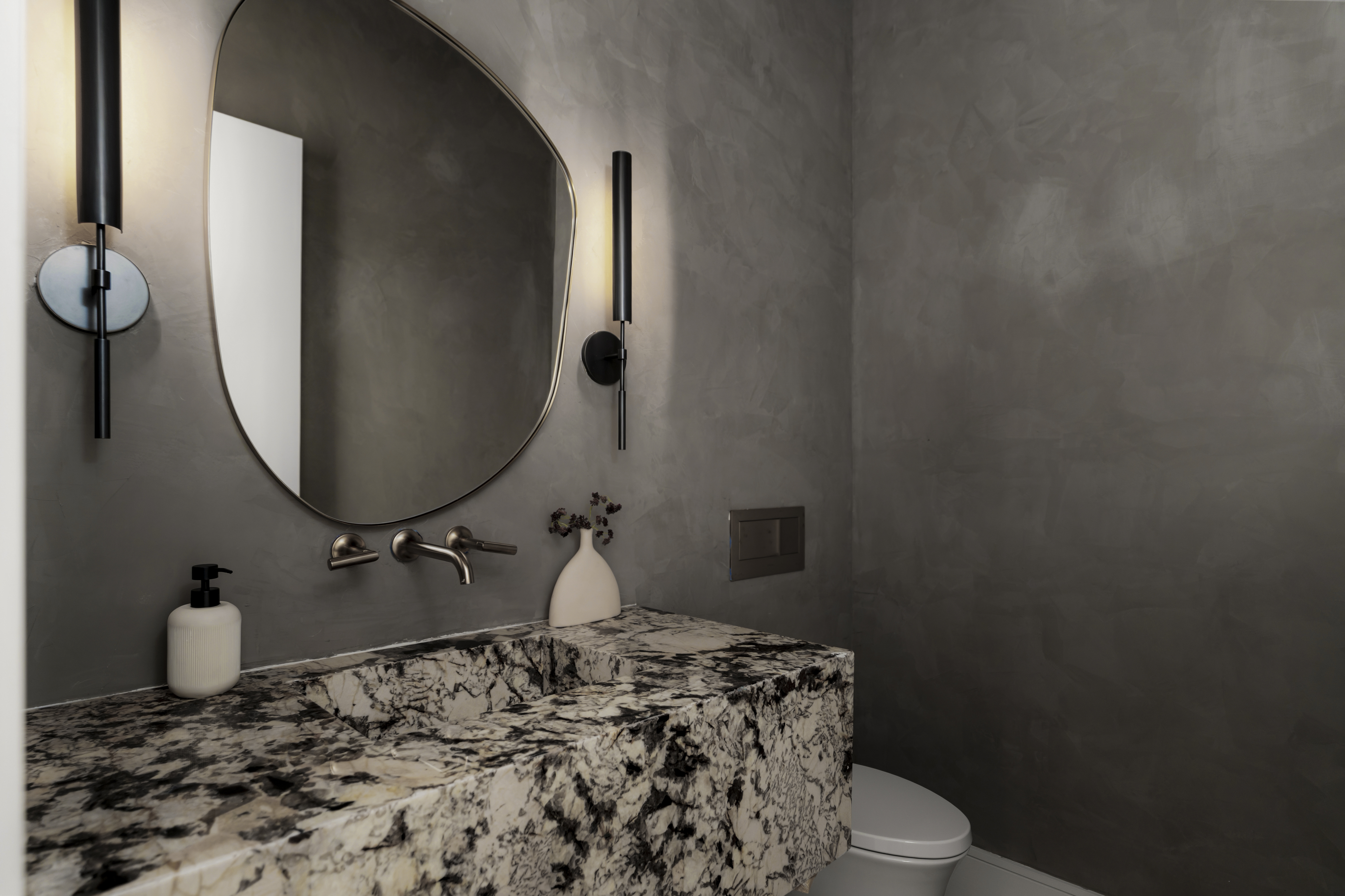 3411 Bridle Path Austin, TX 78703 - Photo 32 of 76 a bathroom with a toilet sink and mirror