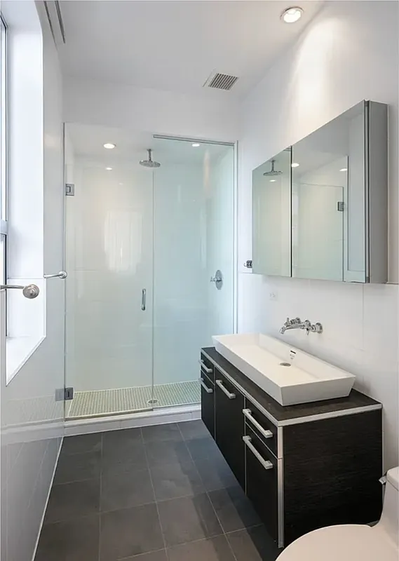 128 Newton Street, Unit 2B Brooklyn, NY 11222 - Photo 7 of 13 a bathroom with a sink and a mirror