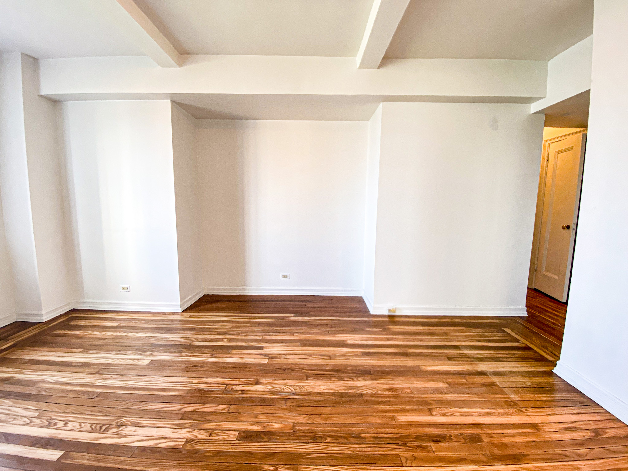 5 Tudor City Place, Unit 627 Manhattan, NY 10017 - Photo 5 of 11 a view of a room with an empty space